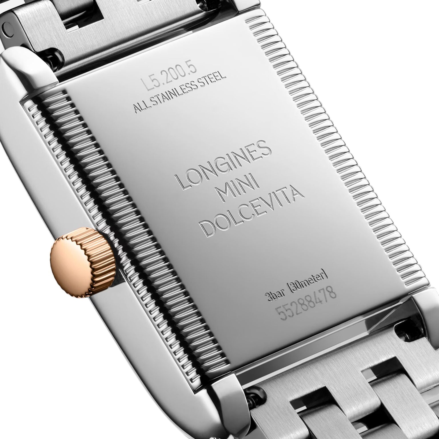 Close-up of the stainless steel back of a Longines Mini Dolcevita watch displaying its model and serial numbers.