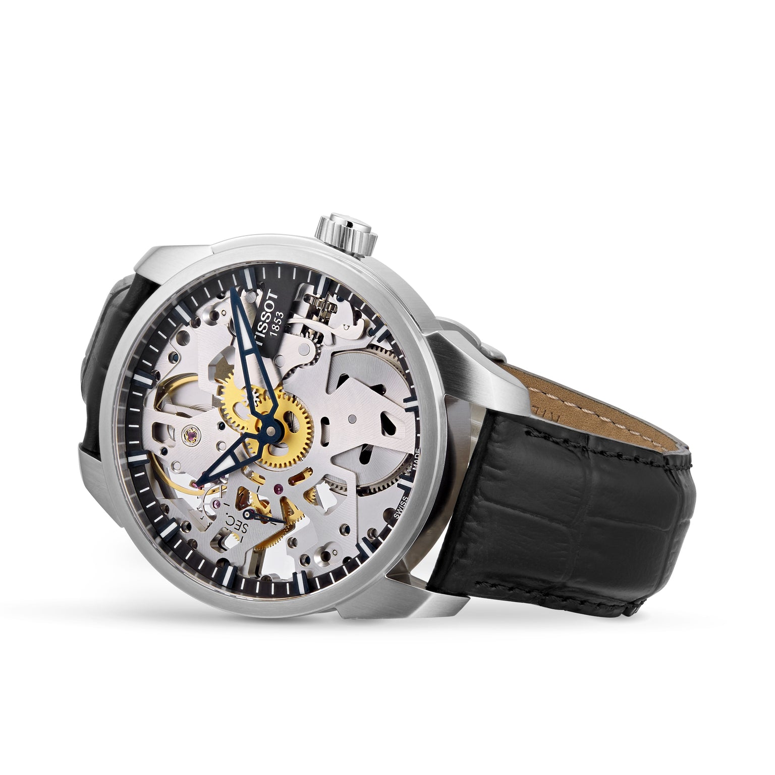 The Tissot T-Complication Squelette Mechanical is a silver skeleton watch with Swiss movement, visible gears, black hour markers, and a black leather strap, displayed angled on a white background.