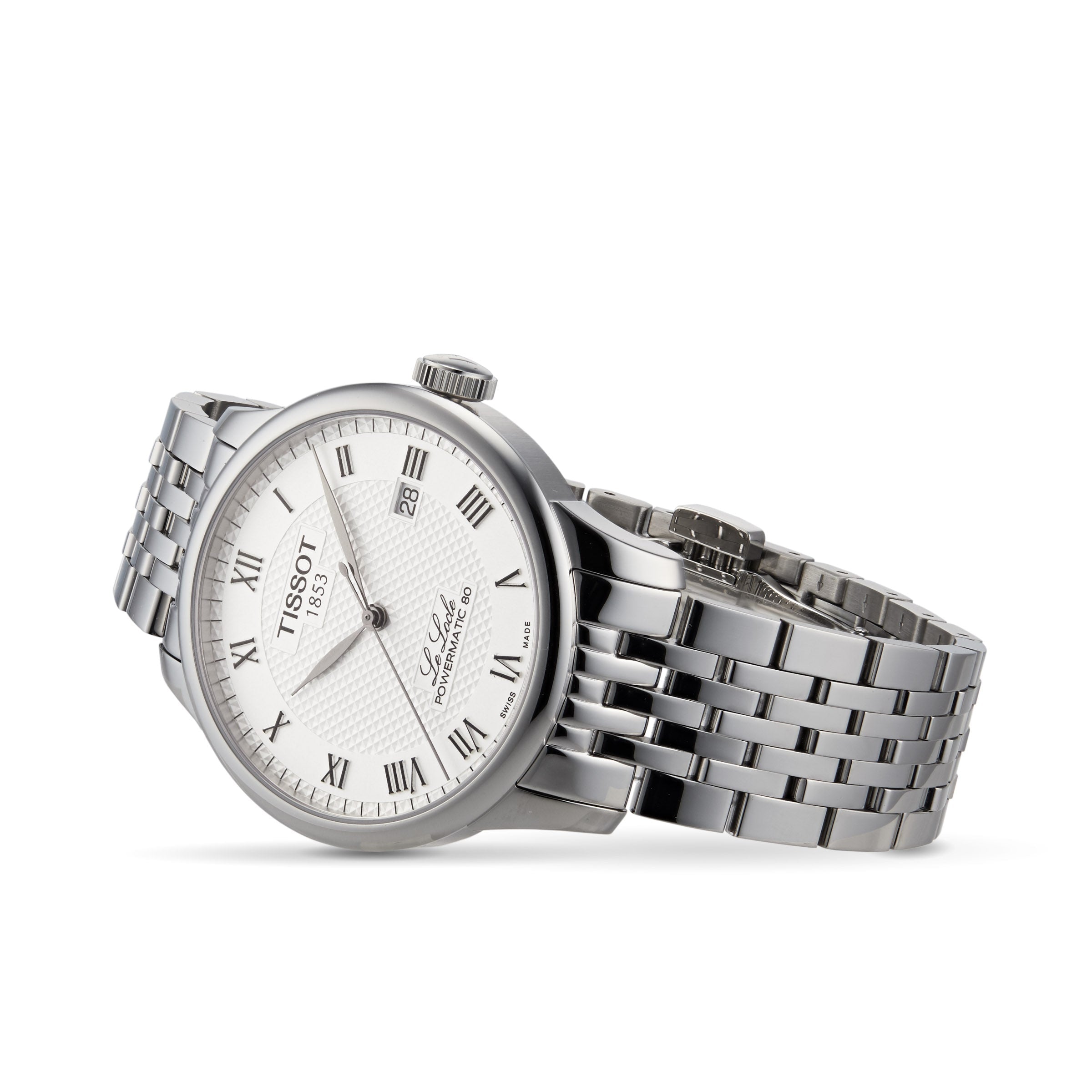 The Tissot Le Locle Powermatic 80 silver wristwatch features a white dial with Roman numerals, date display, and metal link band, presented on a white background. Inspired by the Swiss Jura Mountains.