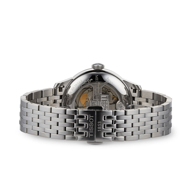 Rear view of a silver Tissot Le Locle Powermatic 80 wristwatch with a metal bracelet, featuring an open case back that reveals its Swiss-crafted movement.