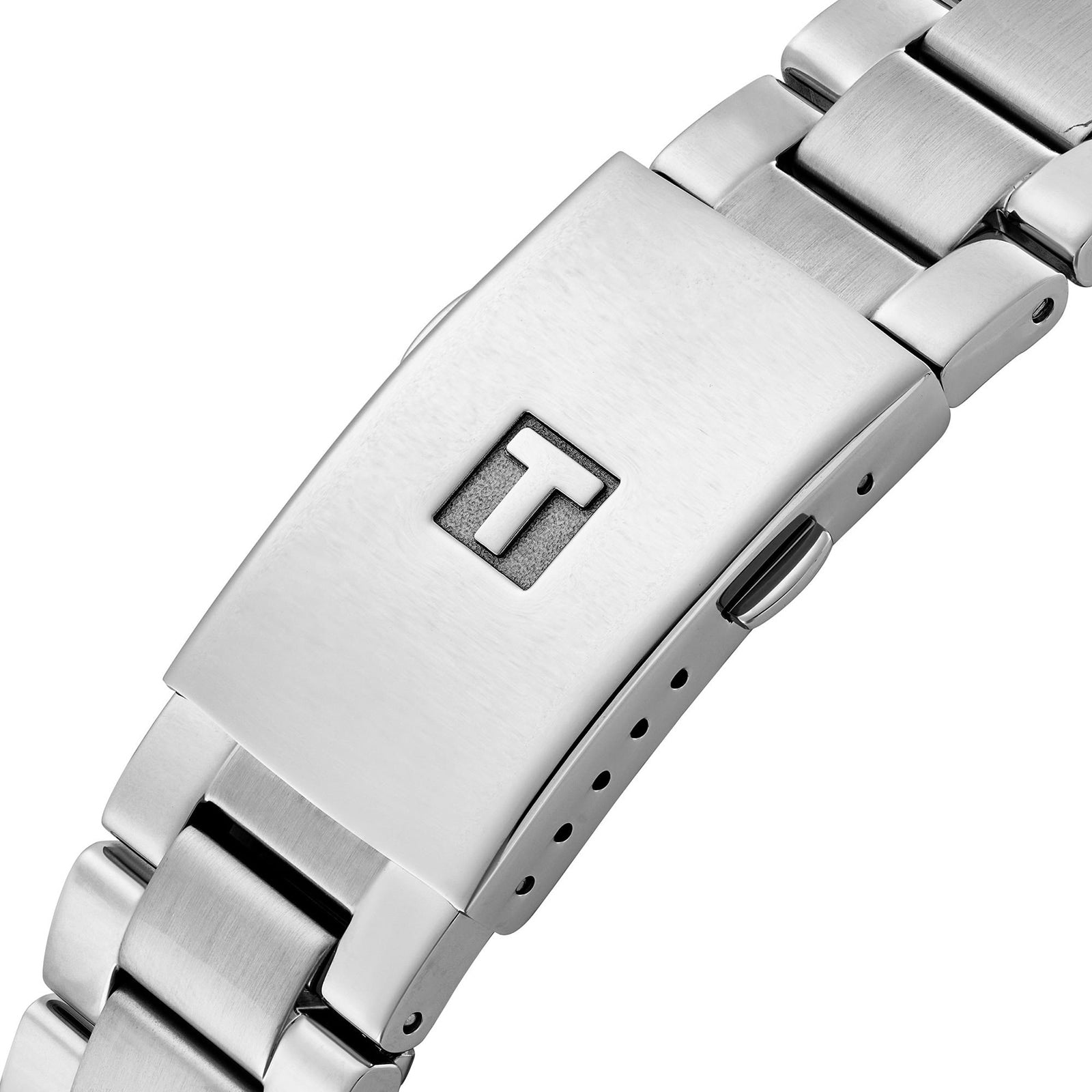 Close-up of a Tissot Chrono XL Classic stainless steel bracelet clasp featuring an engraved T logo on the top surface.