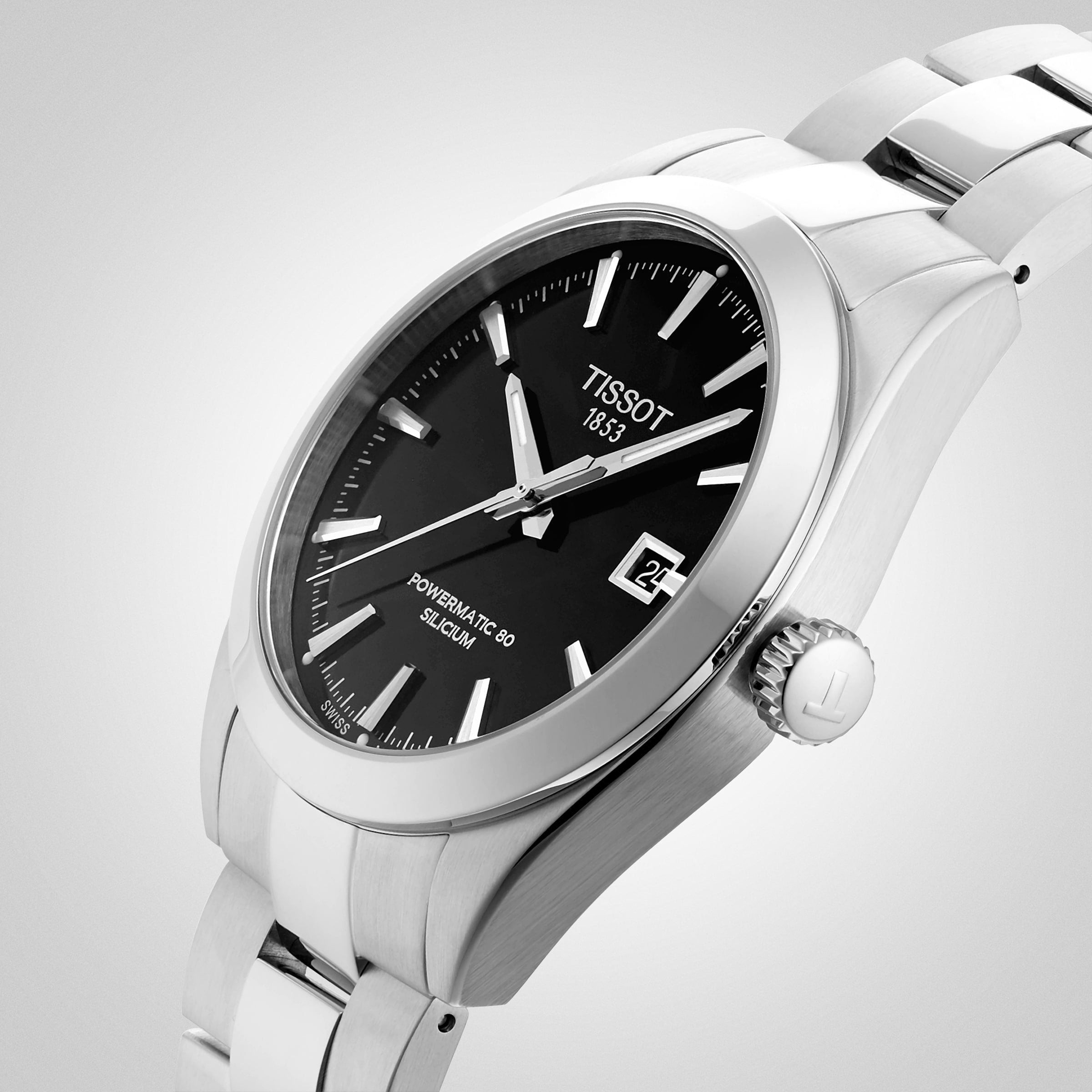 A close-up of the Tissot Gentleman Powermatic 80 Silicium, featuring a stainless steel case, black dial, silver hour markers, date display, and Powermatic 80 movement.