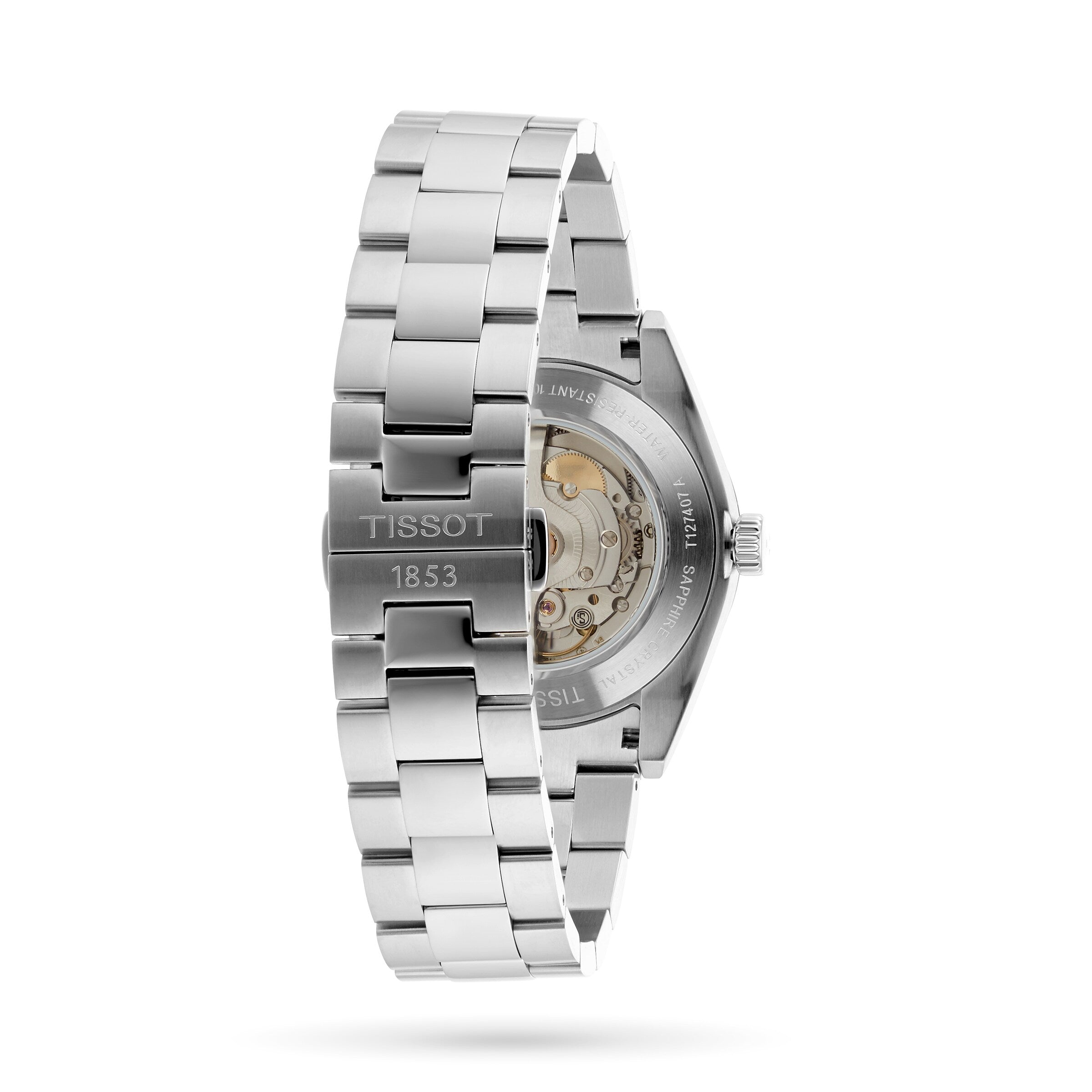 A close-up of the Tissot Gentleman Powermatic 80 Silicium showcases its stainless steel bracelet with engraved clasp, transparent case back, and the precise Powermatic 80 movement within the stainless steel case.