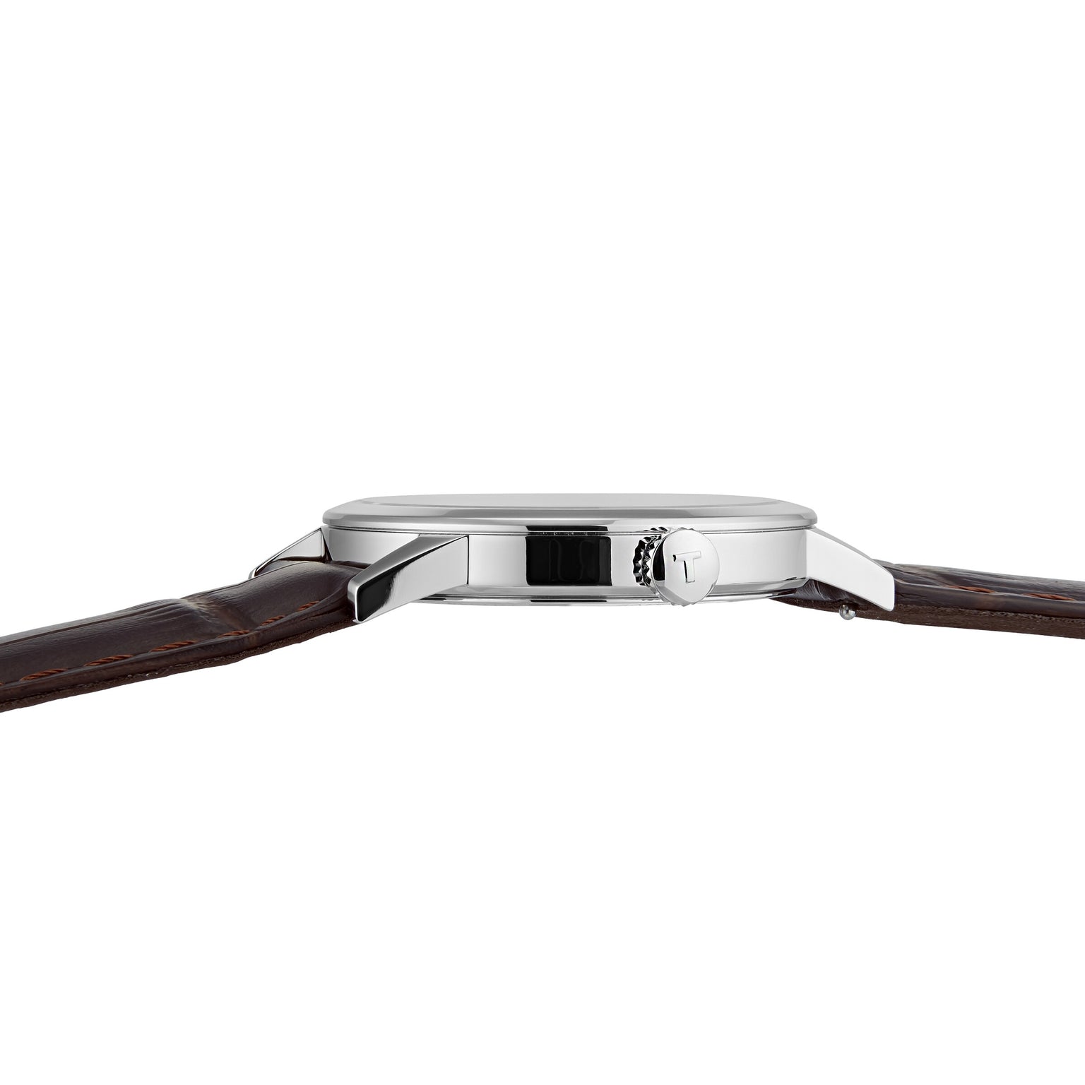 Side view of the Tissot Classic Dream, featuring a silver case and brown leather strap with visible crown and slim profile against a white background—highlighting Tissot’s refined craftsmanship.