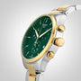 A Tissot Chrono XL Classic wristwatch with a green dial, gold and silver metal band, gold pushers and crown, and stainless steel case is displayed against a light background.