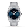 The Tissot PRX is a stainless steel wristwatch featuring a blue dial, silver hour markers, date at 3 o’clock, metal bracelet, and Swiss quartz movement, all inspired by sleek 1970s design.
