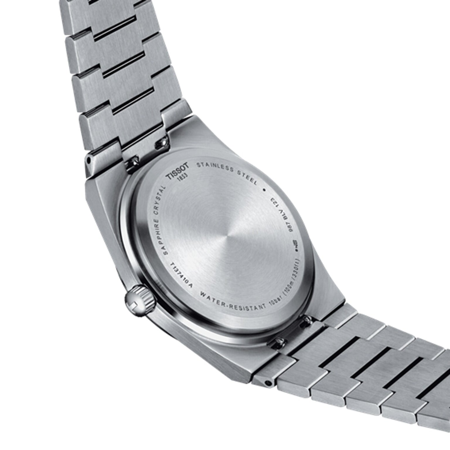 Back view of the Tissot PRX wristwatch with a stainless steel bracelet. The case back shows brand and model details, water resistance info, and material specs, highlighting its 1970s-inspired design and precise Swiss quartz movement.