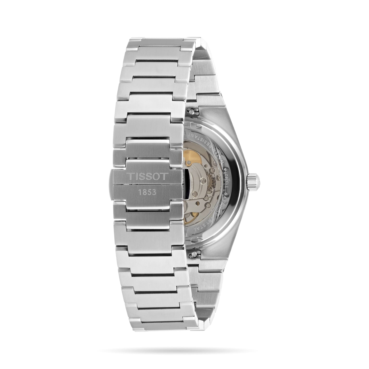 The Tissot PRX Powermatic 80 wristwatch is displayed from the back, revealing its Powermatic 80 movement through a transparent caseback and showcasing its luxurious stainless steel design.