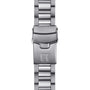 The Tissot Seastar 1000 Powermatic 80 features a silver metal watch band with a clasp engraved with the T logo, displayed on a white background.