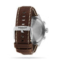 Back view of the Tissot Chrono XL Vintage watch, showcasing its brown leather strap with white stitching, silver buckle, and engraved stainless steel case for a classic look.