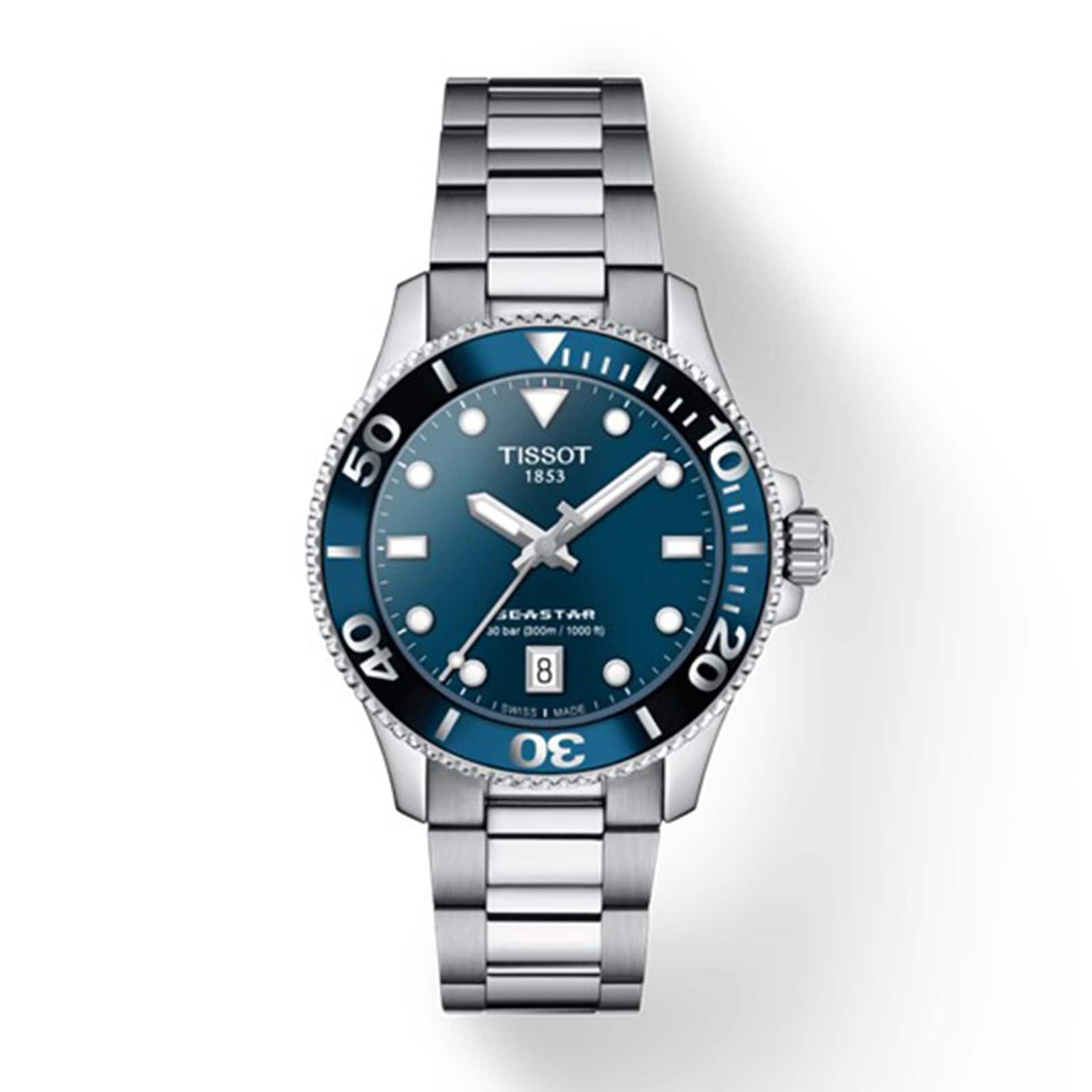 The Tissot Seastar 1000 is a stainless steel divers watch with a blue dial, white markers, rotating bezel, and date at 6 o’clock. Shown on a white background. Water resistant for reliable performance.