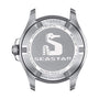 Back view of the Tissot Seastar 1000 case showing the seahorse logo, stainless steel build, water resistance info, and a sapphire crystal label.