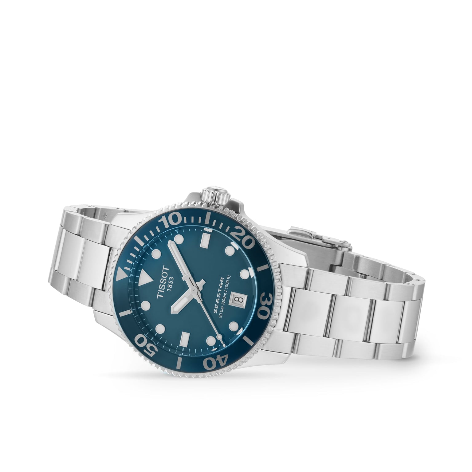 The Tissot Seastar 1000, a silver diver’s watch with a teal dial, white hour markers, rotating bezel, and metal link bracelet, is showcased at an angle on a white background—blending style with functionality.