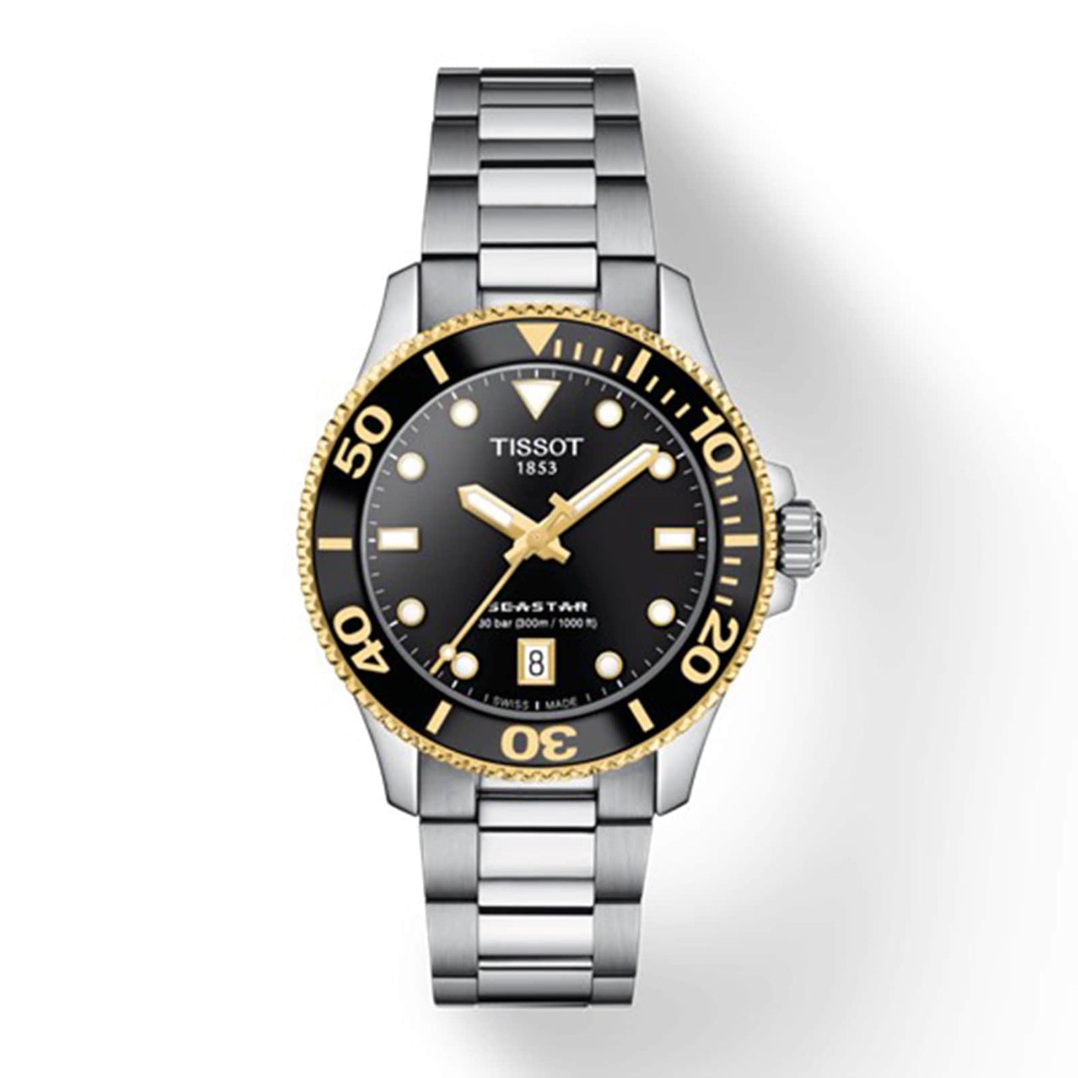 The Tissot Seastar 1000 features a silver and gold metal band, black bezel and dial, gold accents, SuperLuminova® hands, and a date display at 6 o’clock.