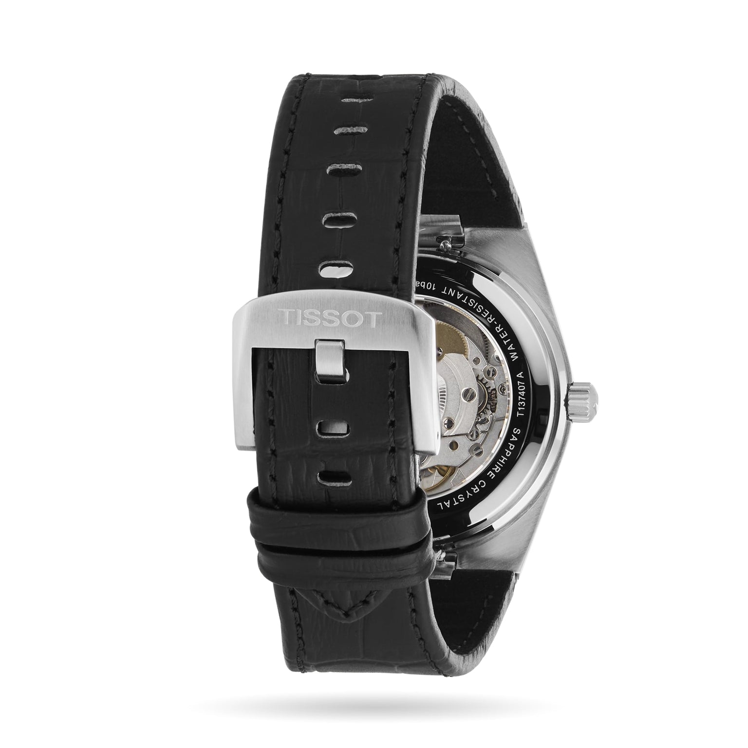 Back view of the Tissot PRX Powermatic 80 wristwatch with a black leather strap, stainless steel case, silver Tissot-logo buckle, and visible Powermatic 80 movement through its transparent case back.