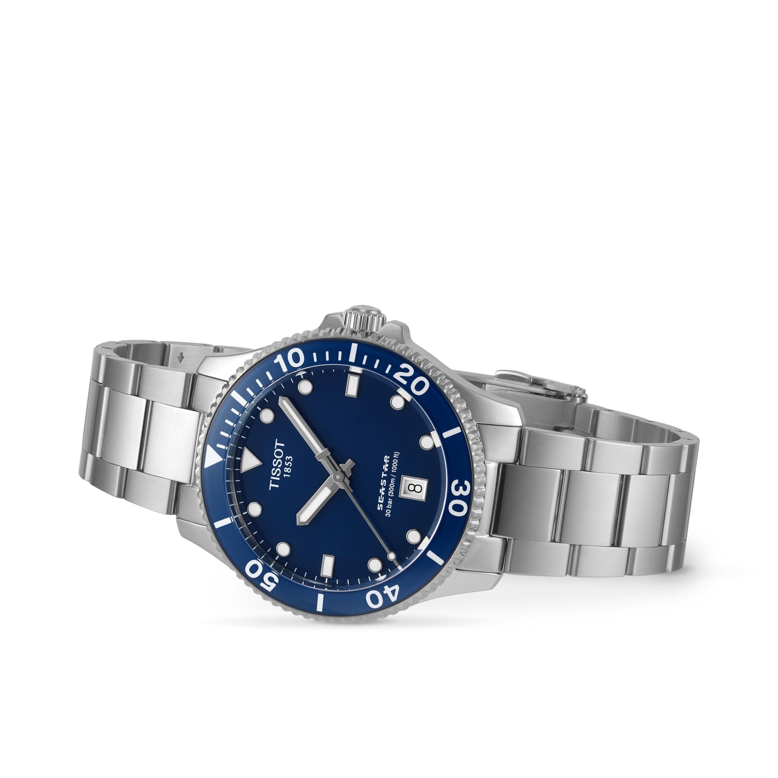 The Tissot Seastar 1000, a stainless steel diver’s watch with blue dial, date display, and rotating bezel, is shown angled on white; this stylish water-resistant timepiece blends functionality and design.