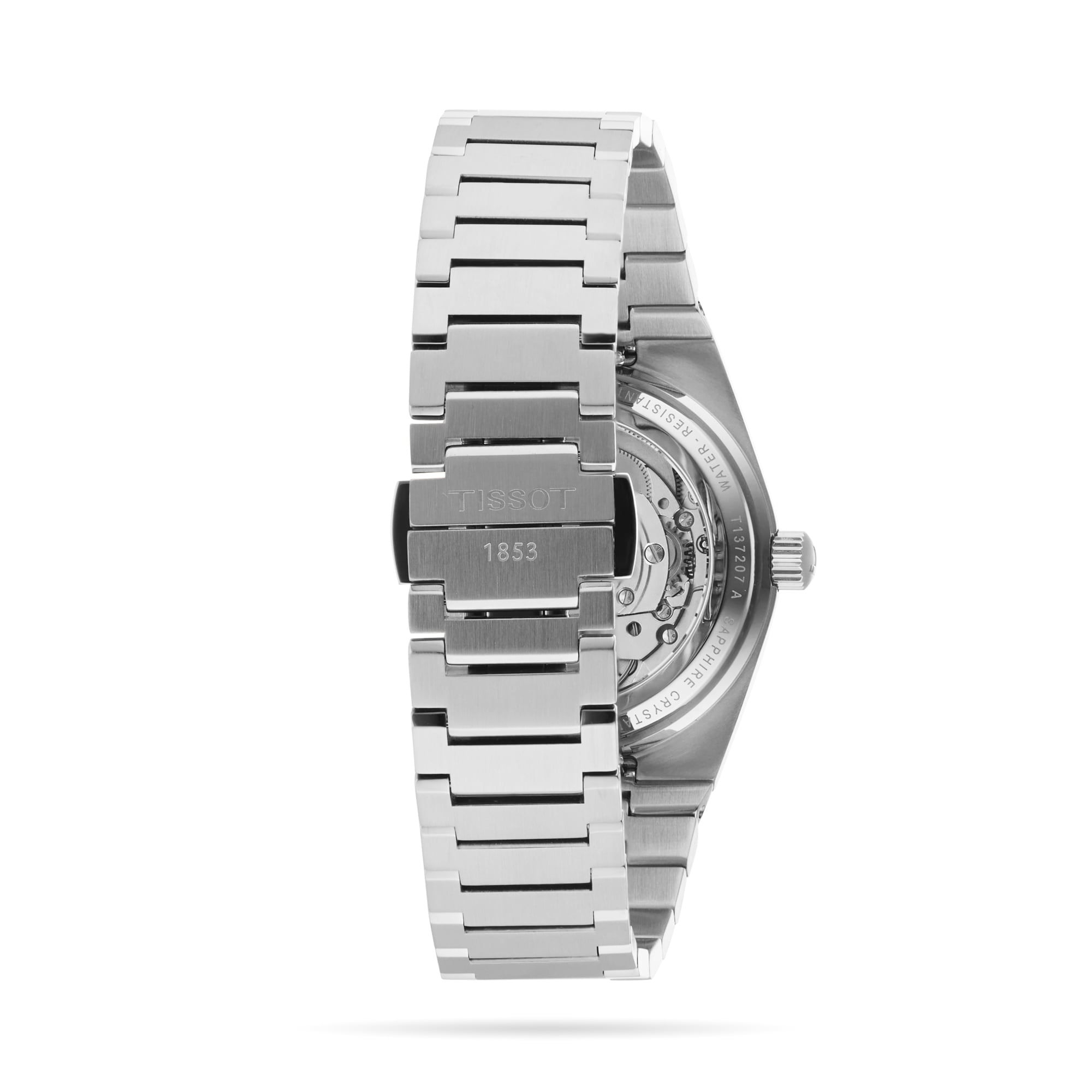 A Tissot PRX Powermatic 80 wristwatch in stainless steel, seen from the back with a clasp engraved Tissot 1853 and part of the Powermatic 80 movement visible.