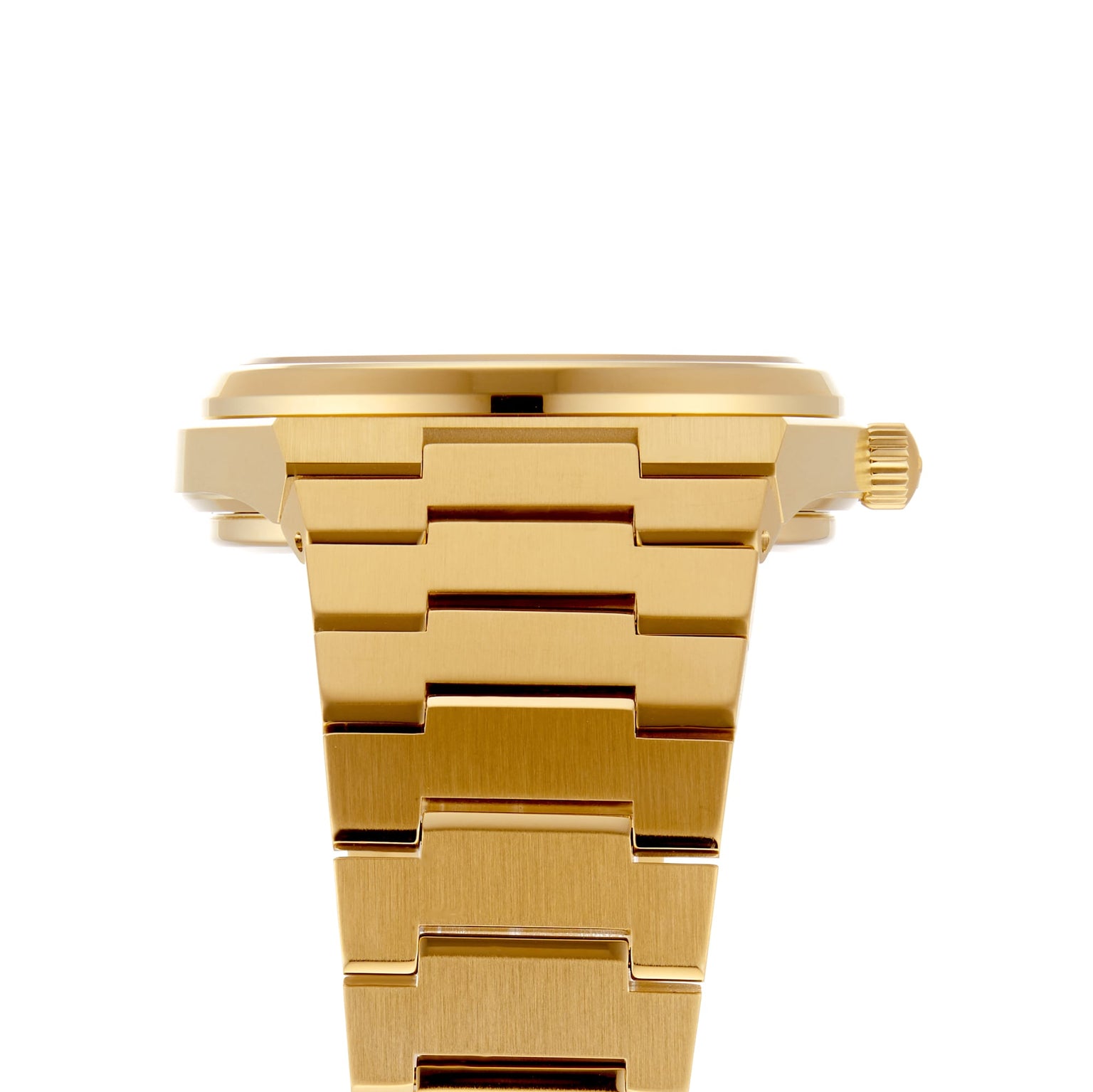 Side view of the Tissot PRX Powermatic 80 in gold, showcasing a metal link bracelet, right-side crown, and the innovative Nivachron hairspring.