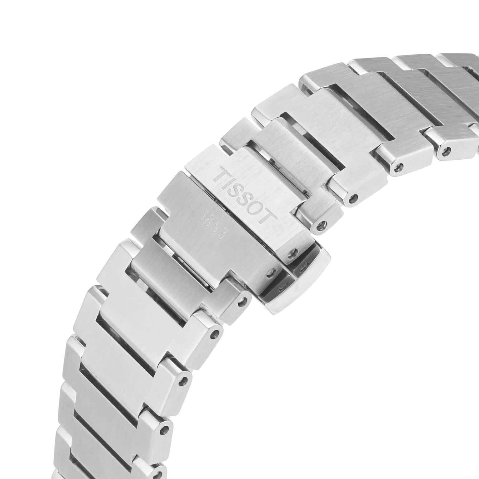 Close-up of a stainless steel Tissot PRX Powermatic 80 bracelet with visible clasp, displaying engraved branding and detailed links.