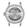 Back view of the Tissot Le Locle Powermatic 80 20th Anniversary watch, showcasing its automatic movement, engraved details, and intricate components through a transparent case back.