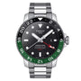 The Tissot Seastar 1000 Powermatic 80 GMT features a stainless steel band, black and green bezel, black dial, date display, GMT hand, and water-resistant sapphire crystal.