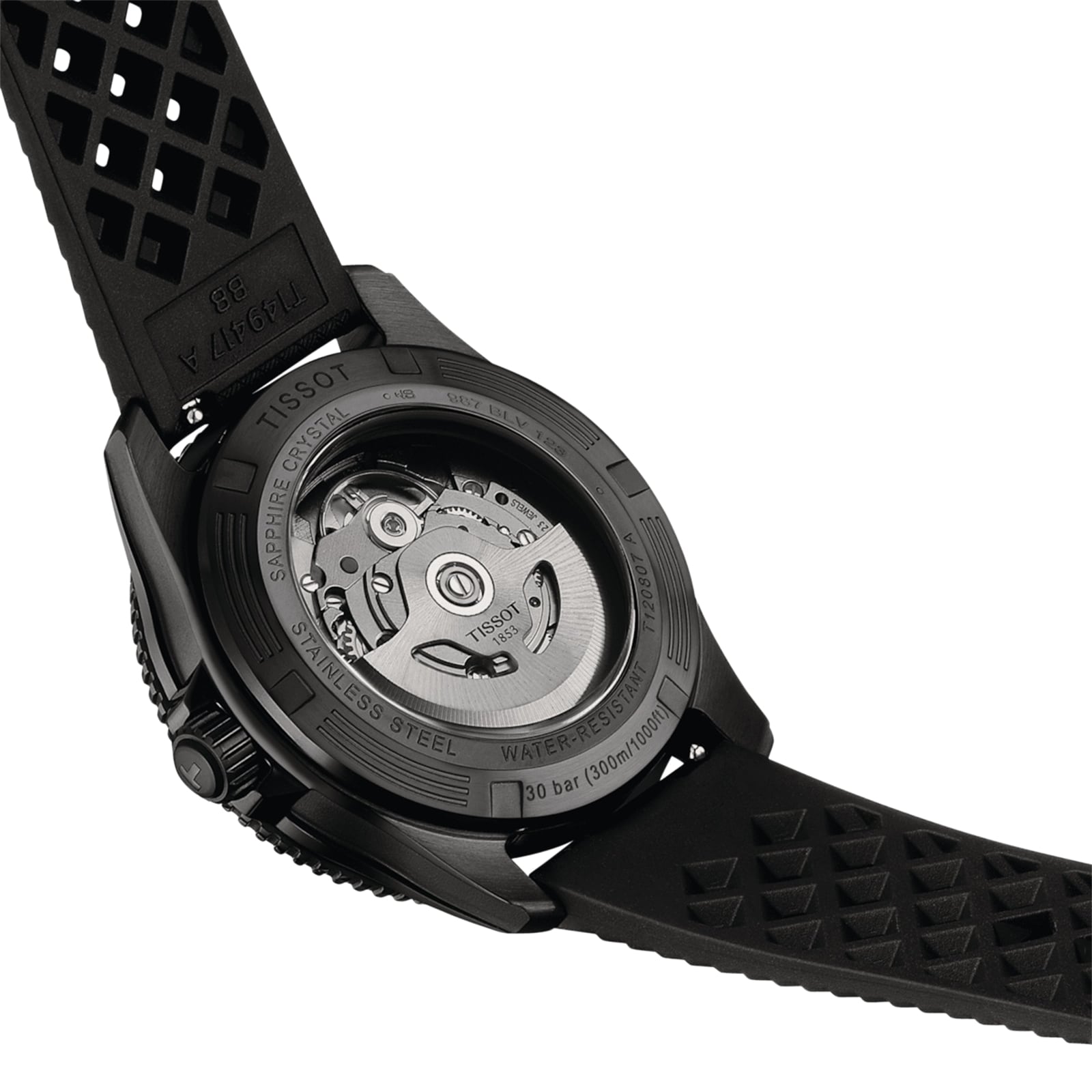 A close-up of the back of the Tissot Seastar 1000 Powermatic 80 shows its black rubber strap and the Powermatic 80 automatic movement visible through the transparent case back.