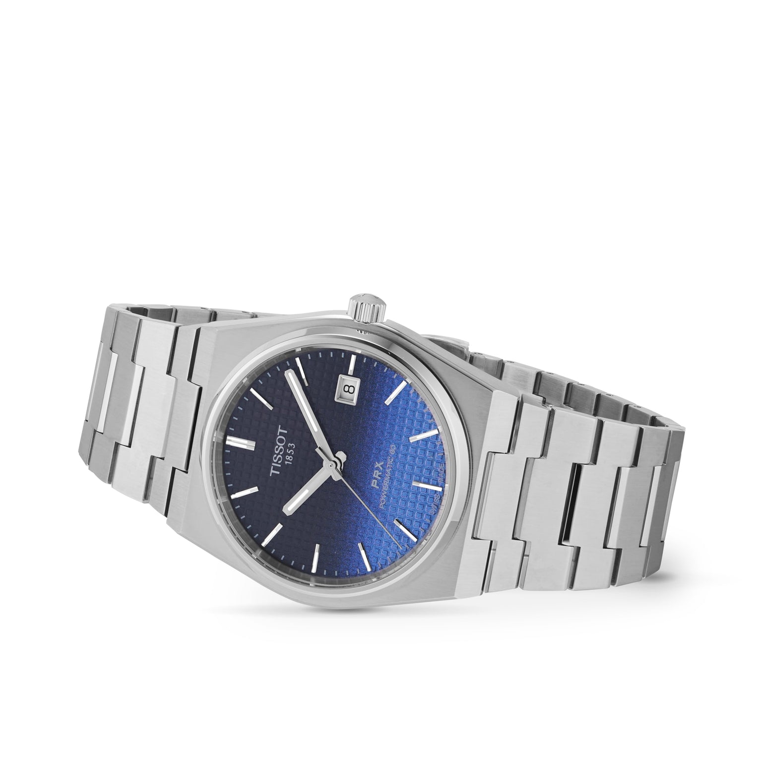 The Tissot PRX Powermatic 80 wristwatch features stainless steel construction, an automatic movement, a blue textured dial with silver hour markers, and a date display at 3 o’clock, shown at a slight angle.