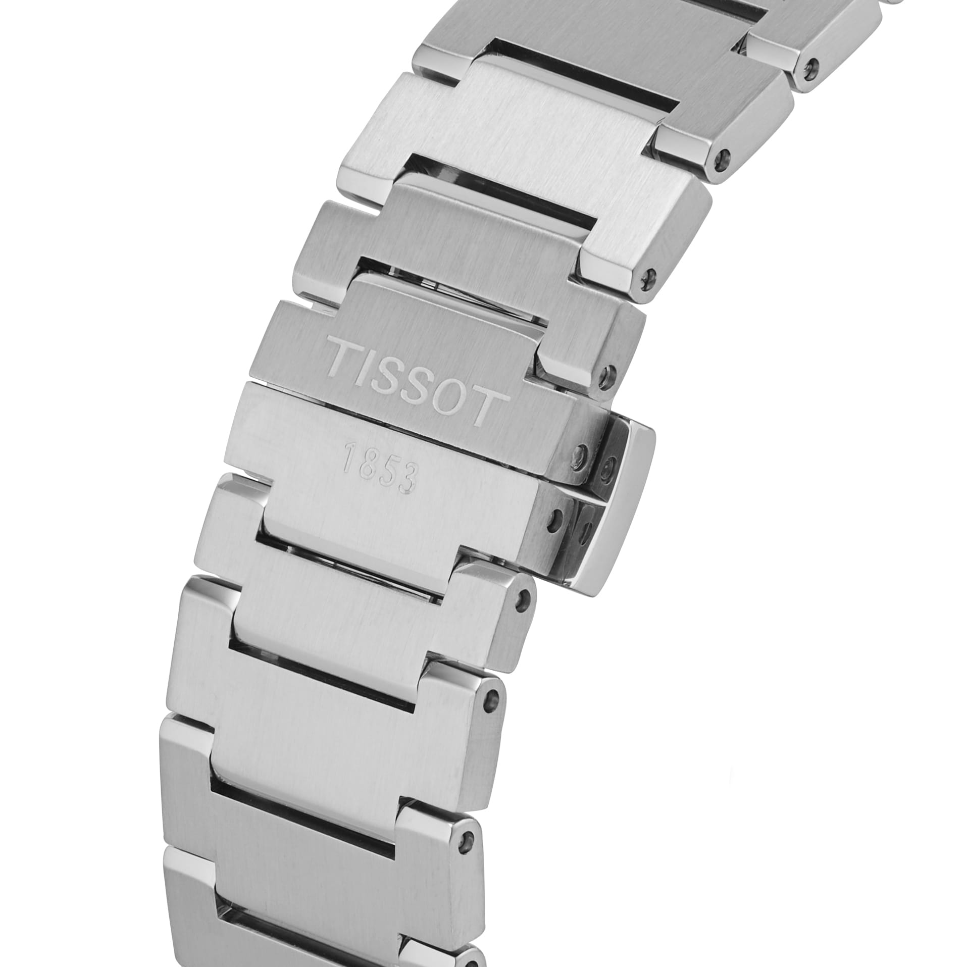 Close-up of the Tissot PRX Powermatic 80s stainless steel bracelet, highlighting the clasp engraved with Tissot and 1853.