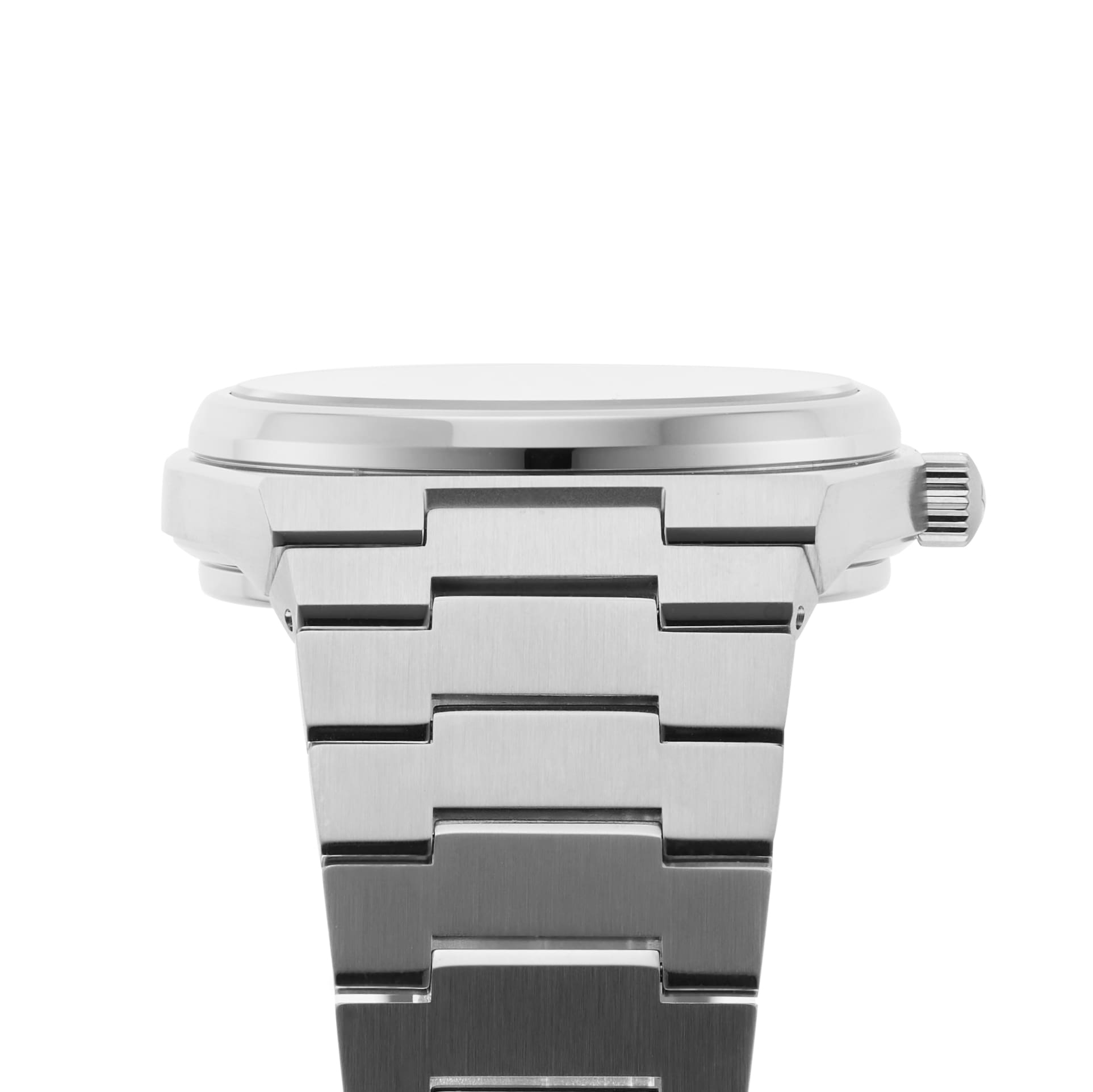 Side view of a silver Tissot PRX Powermatic 80 wristwatch with a stainless steel bracelet and visible crown, set against a white background.