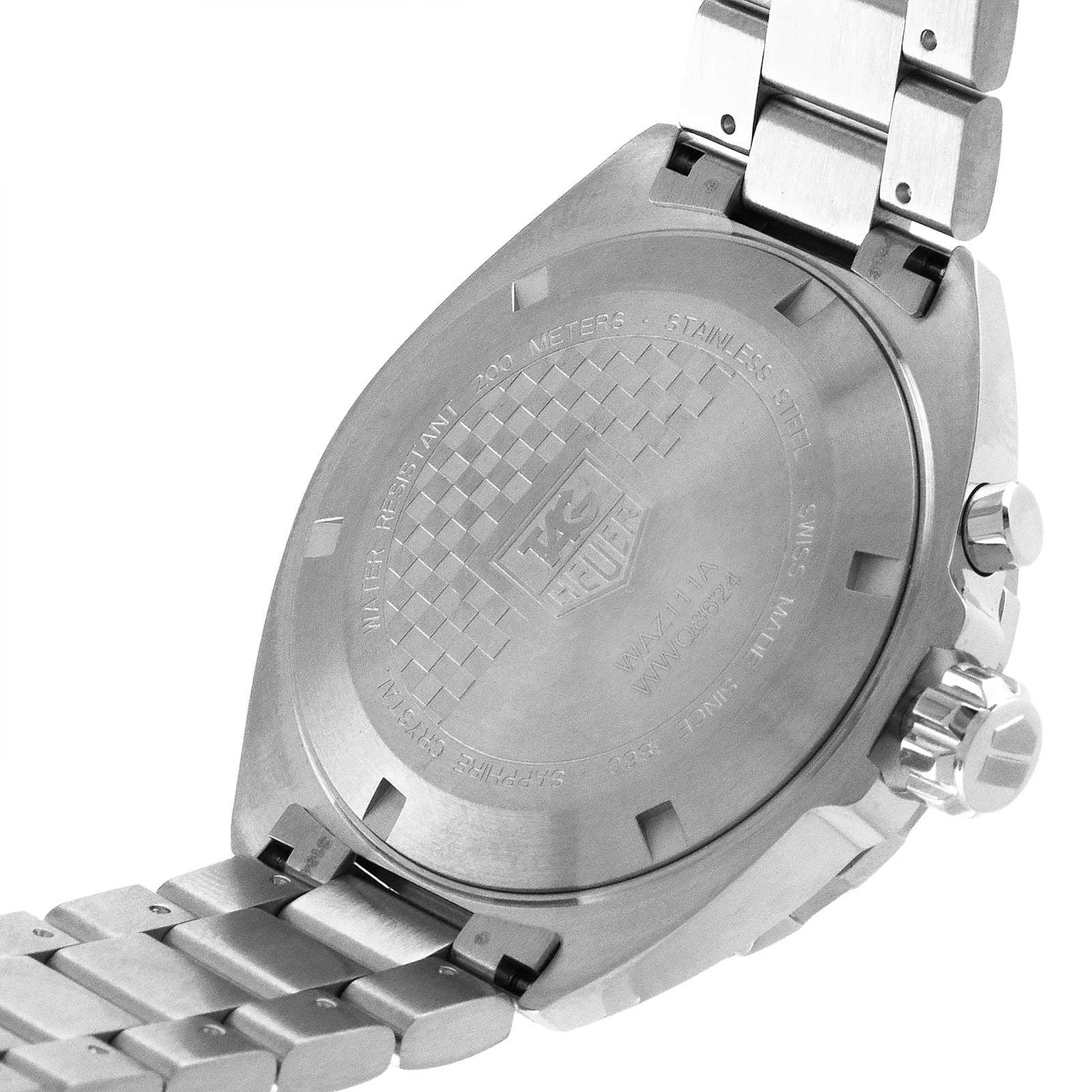 Close-up of the back of a TAG Heuer Formula 1 Date watch, showing the engraved TAG Heuer logo and specifications on its stainless steel case and metal bracelet.