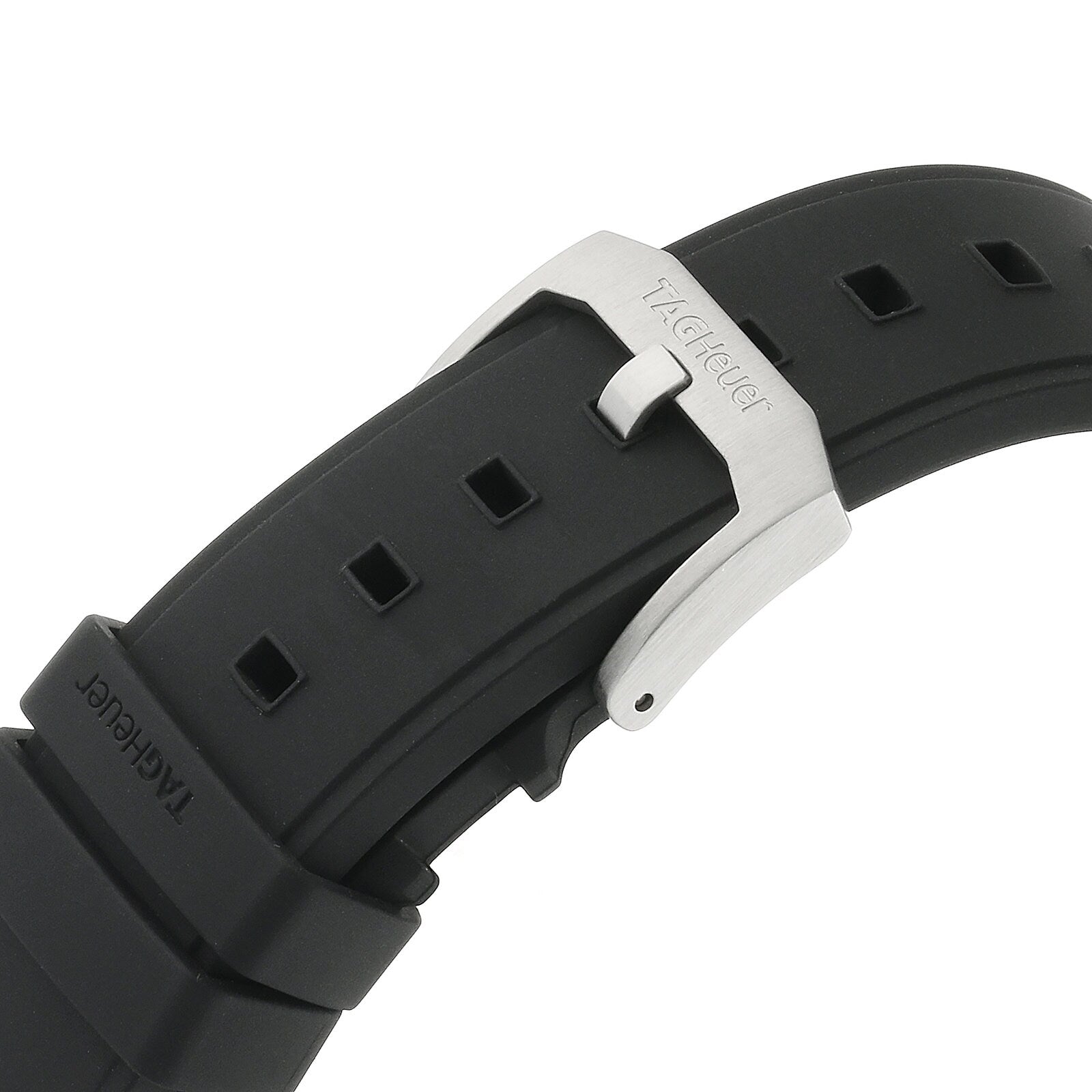 Close-up of a black rubber strap from the TAG Heuer Formula 1 Chronograph, featuring a silver buckle engraved with the TAG Heuer logo.