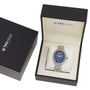 A TAG Heuer Formula 1 Chronograph wristwatch with a blue face and stainless steel case is shown in an open branded box beside its closed outer box.