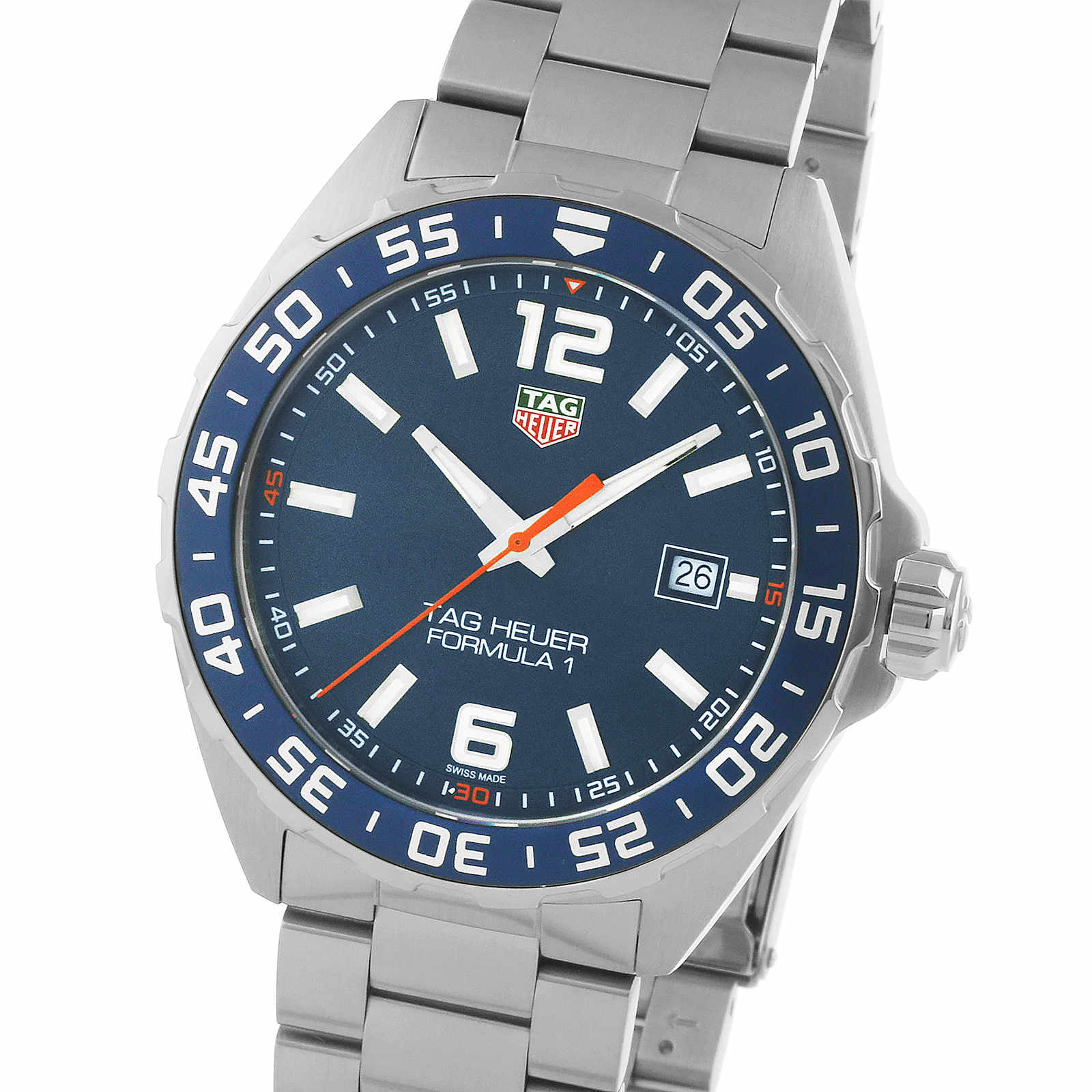 The TAG Heuer Formula 1 Date is a stainless steel watch featuring a blue sunray dial, bold white numerals, orange second hand, date at 3 o’clock, silver metal band, and reliable quartz movement.