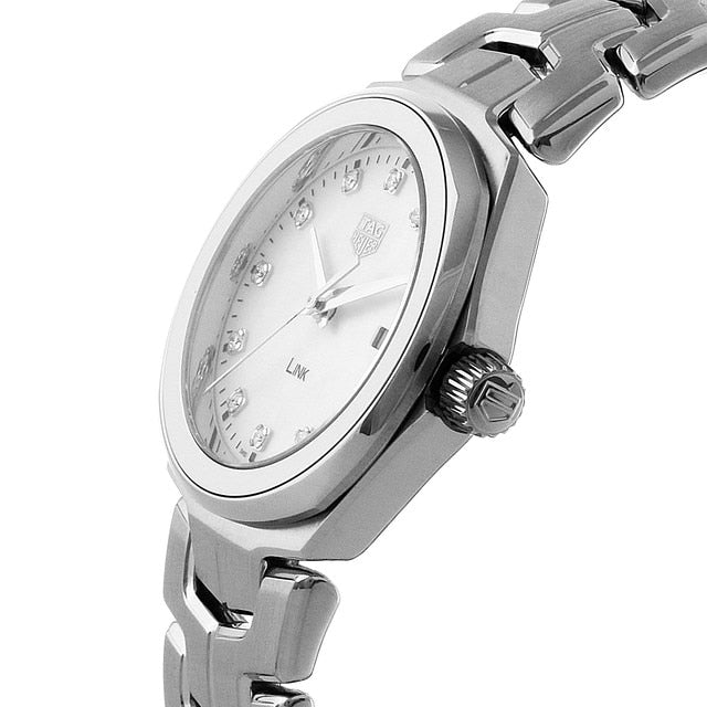 A close-up of the TAG Heuer Link Date wristwatch featuring a round face, diamond indexes on a mother-of-pearl dial, and the iconic S-shaped bracelet.