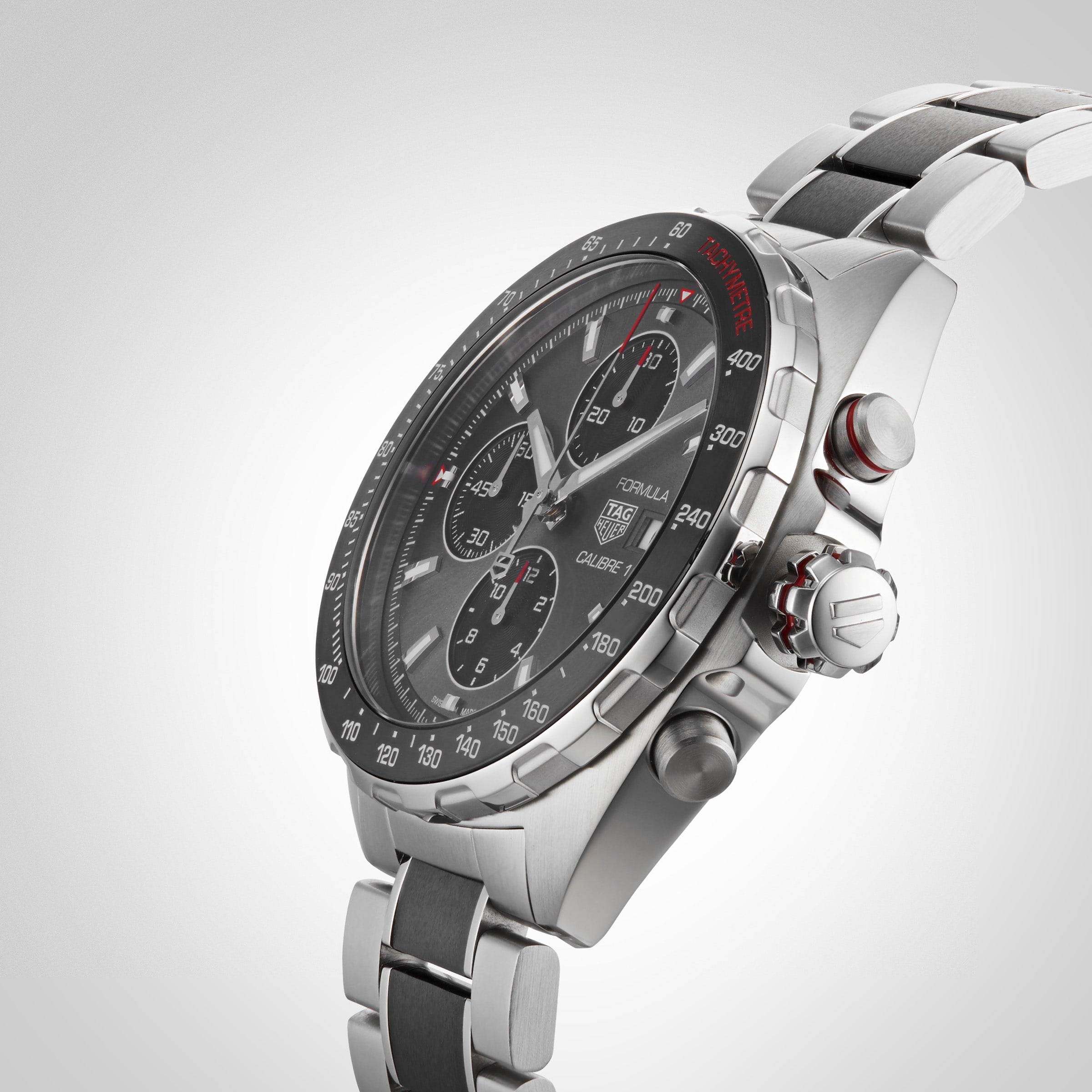 Close-up angled view of the TAG Heuer Formula 1 Chronograph, featuring a stainless steel case, black bezel, three subdials, metal bracelet, and powered by the precise Calibre 16 movement.