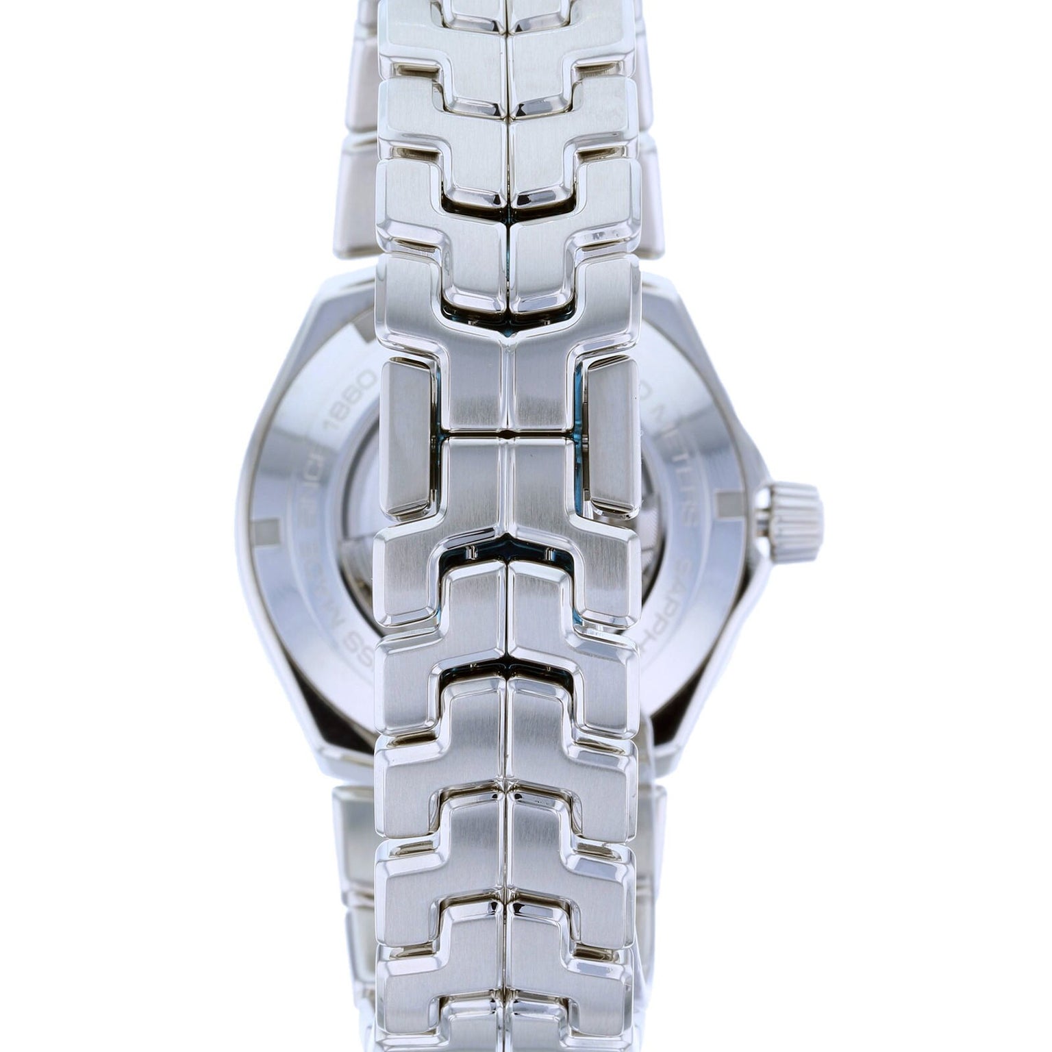 Close-up of the TAG Heuer Link Dates silver metal watchband and case, viewed from the back.