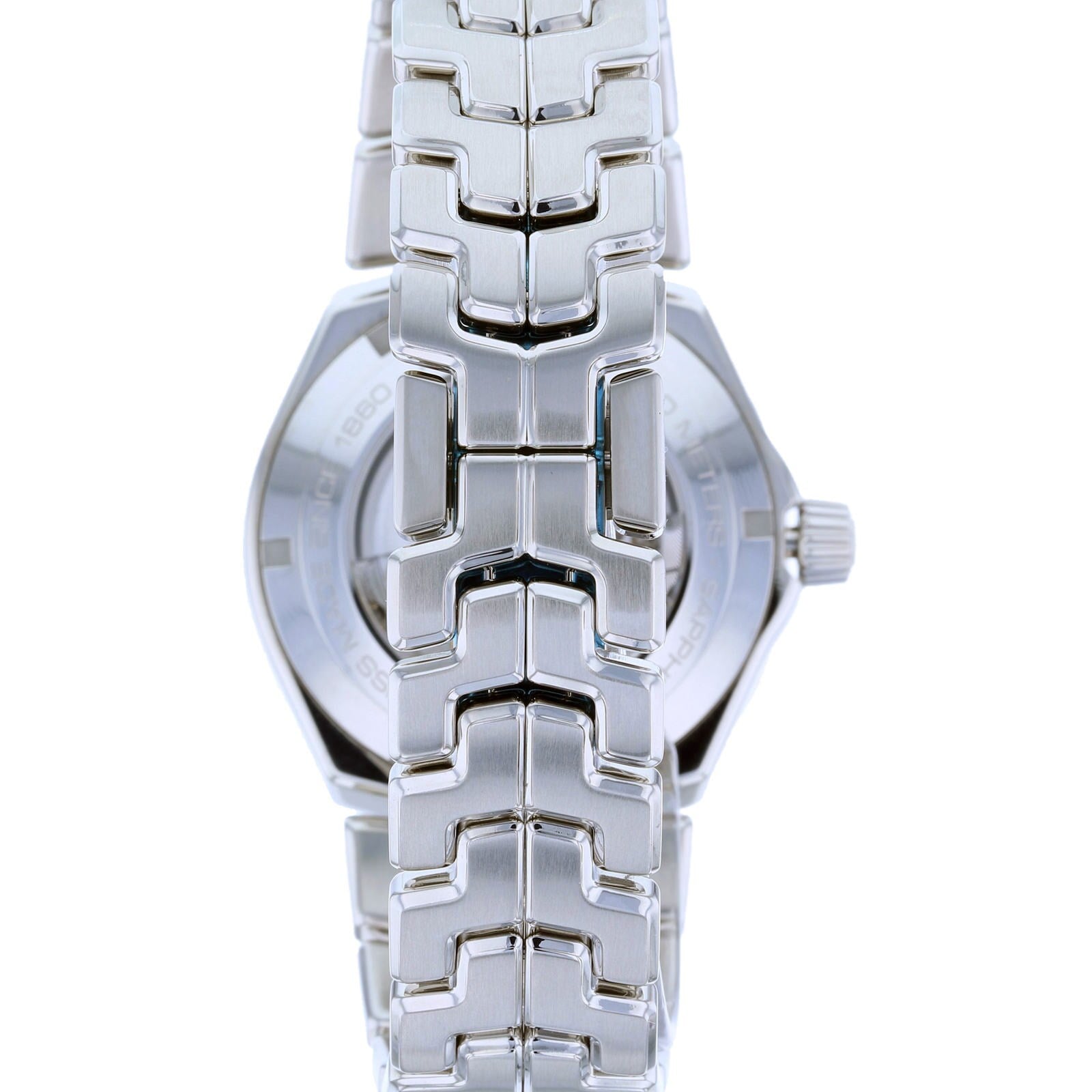 Close-up of the TAG Heuer Link Dates silver metal watchband and case, viewed from the back.