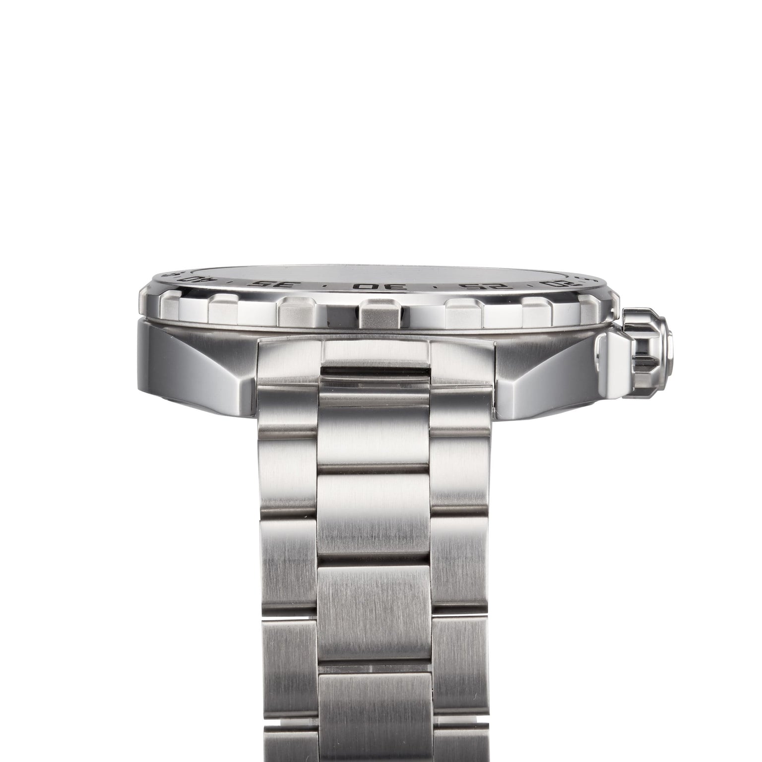Side view of the TAG Heuer Formula 1 Date watch, featuring a stainless steel link bracelet, raised bezel, visible crown, and sleek brushed finish.