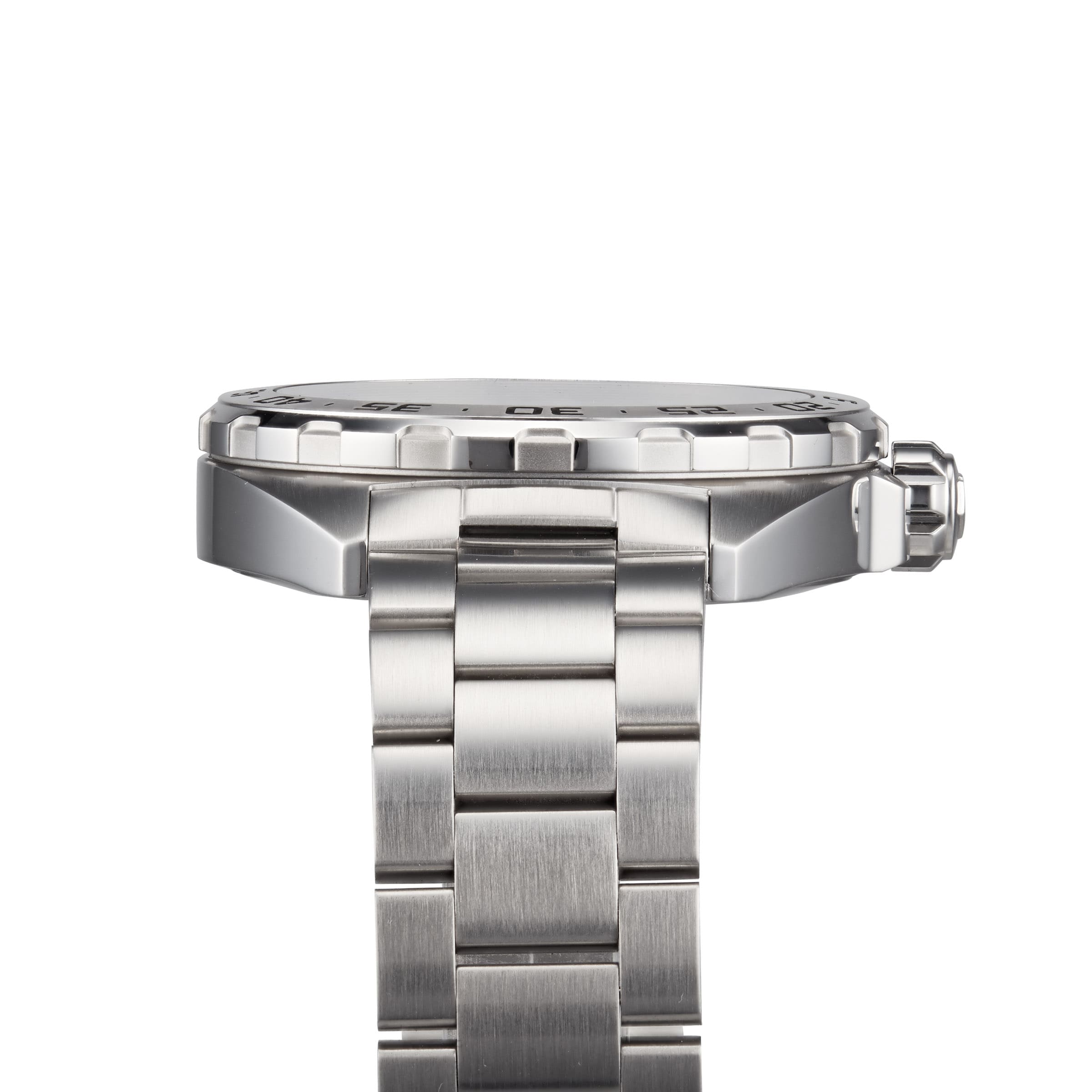 Side view of the TAG Heuer Formula 1 Date watch, featuring a stainless steel link bracelet, raised bezel, visible crown, and sleek brushed finish.