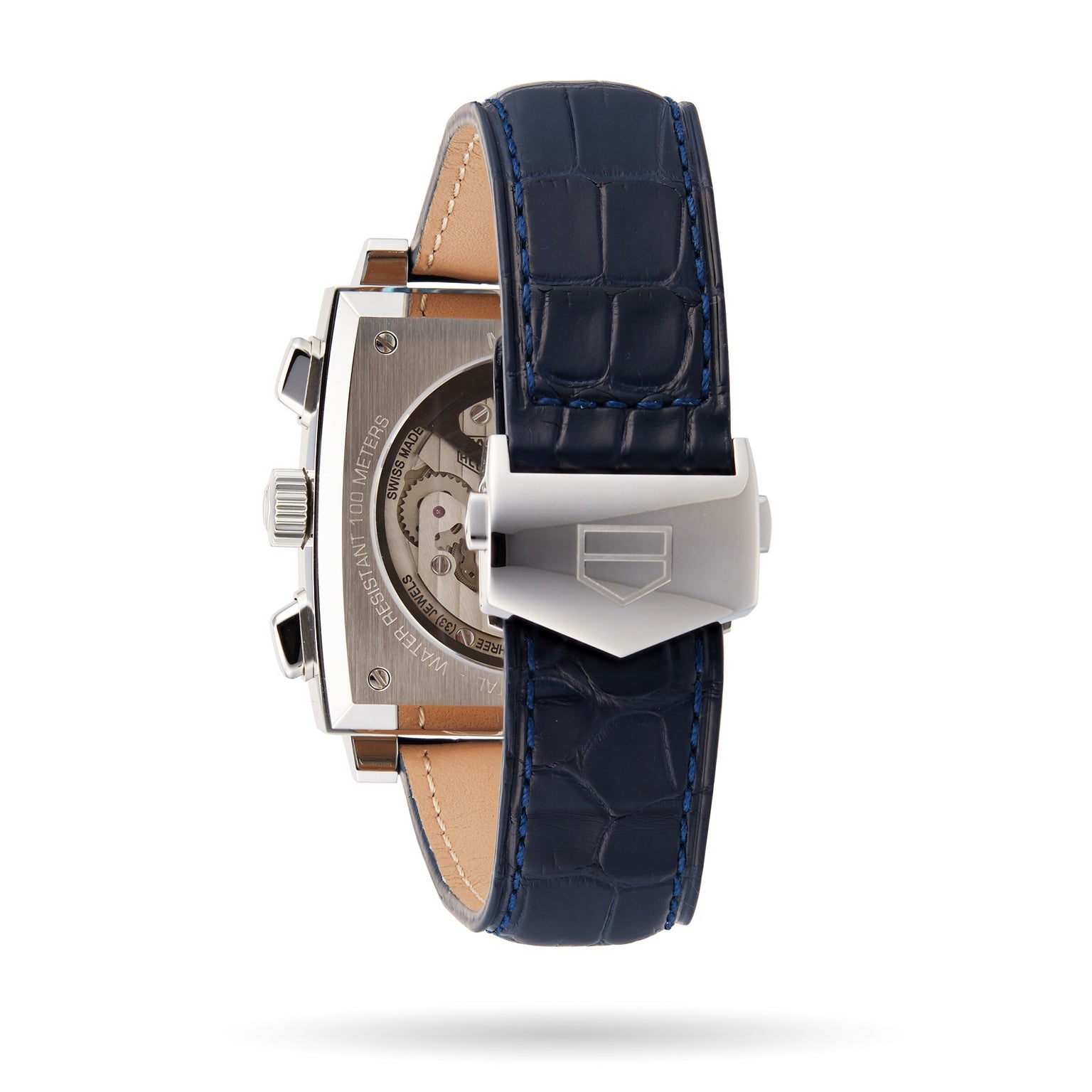 A close-up of the back of the TAG Heuer Monaco Chronograph, featuring a square case, blue leather strap with metal clasp, and showcasing its intricate Heuer 02 movement.