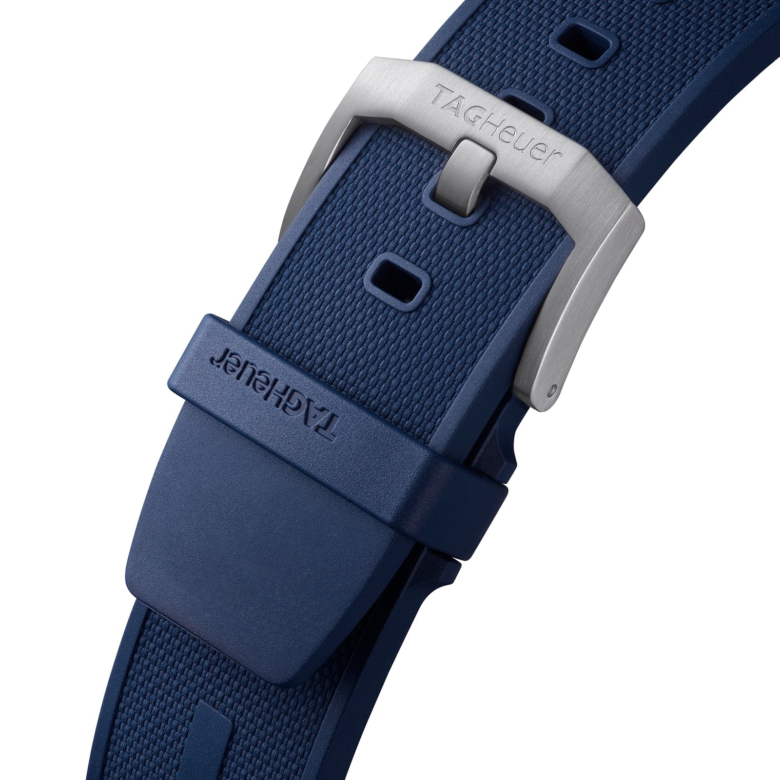 Close-up of a blue textured TAG Heuer rubber strap with a silver buckle engraved with the brands name, designed for the Special Edition Formula 1 Chronograph x Red Bull Racing.