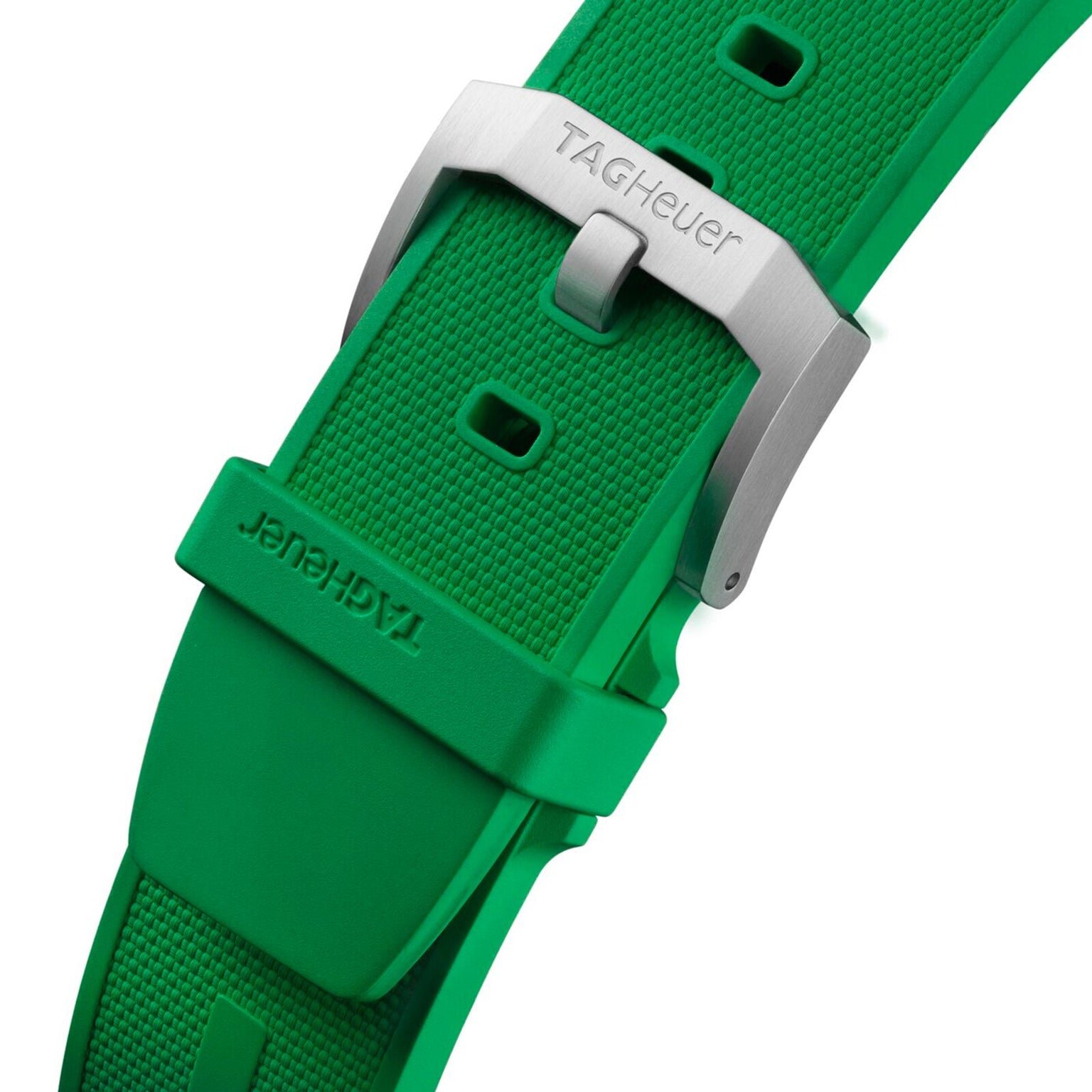 Close-up of a green textured rubber strap with a brushed stainless steel buckle from TAG Heuer, designed for the Formula 1 Chronograph.