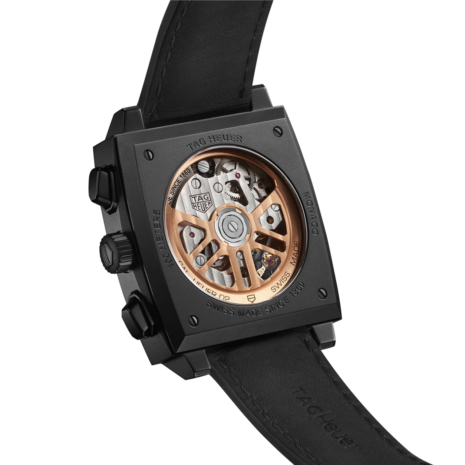 Back view of the TAG Heuer Monaco Chronograph, featuring a black DLC titanium case, black leather strap, and an exposed Heuer 02 movement with a rose gold rotor.