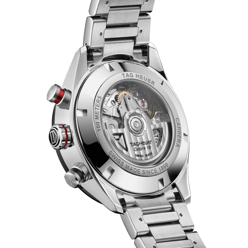Close-up of the back of a TAG Heuer Carrera Chronograph, showcasing its stainless steel case and bracelet with engraved details and the visible automatic movement.