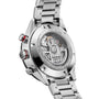 Close-up of the back of a TAG Heuer Carrera Chronograph, showcasing its stainless steel case and bracelet with engraved details and the visible automatic movement.