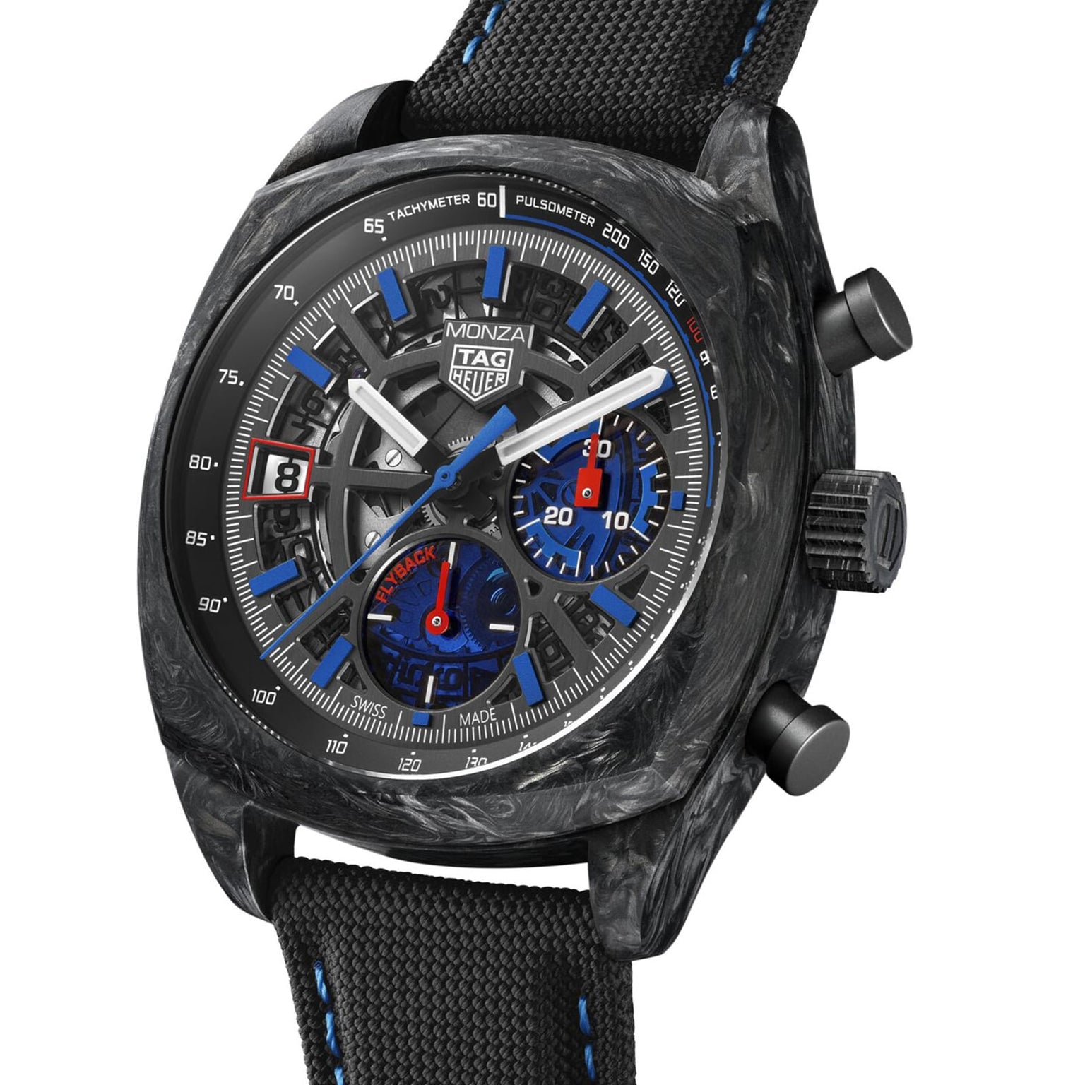 The TAG Heuer Monza Flyback Chronometer features a black carbon case, blue and red chronograph subdials, tachymeter and pulsometer scales, and a black fabric strap, all inspired by competition motorsports.