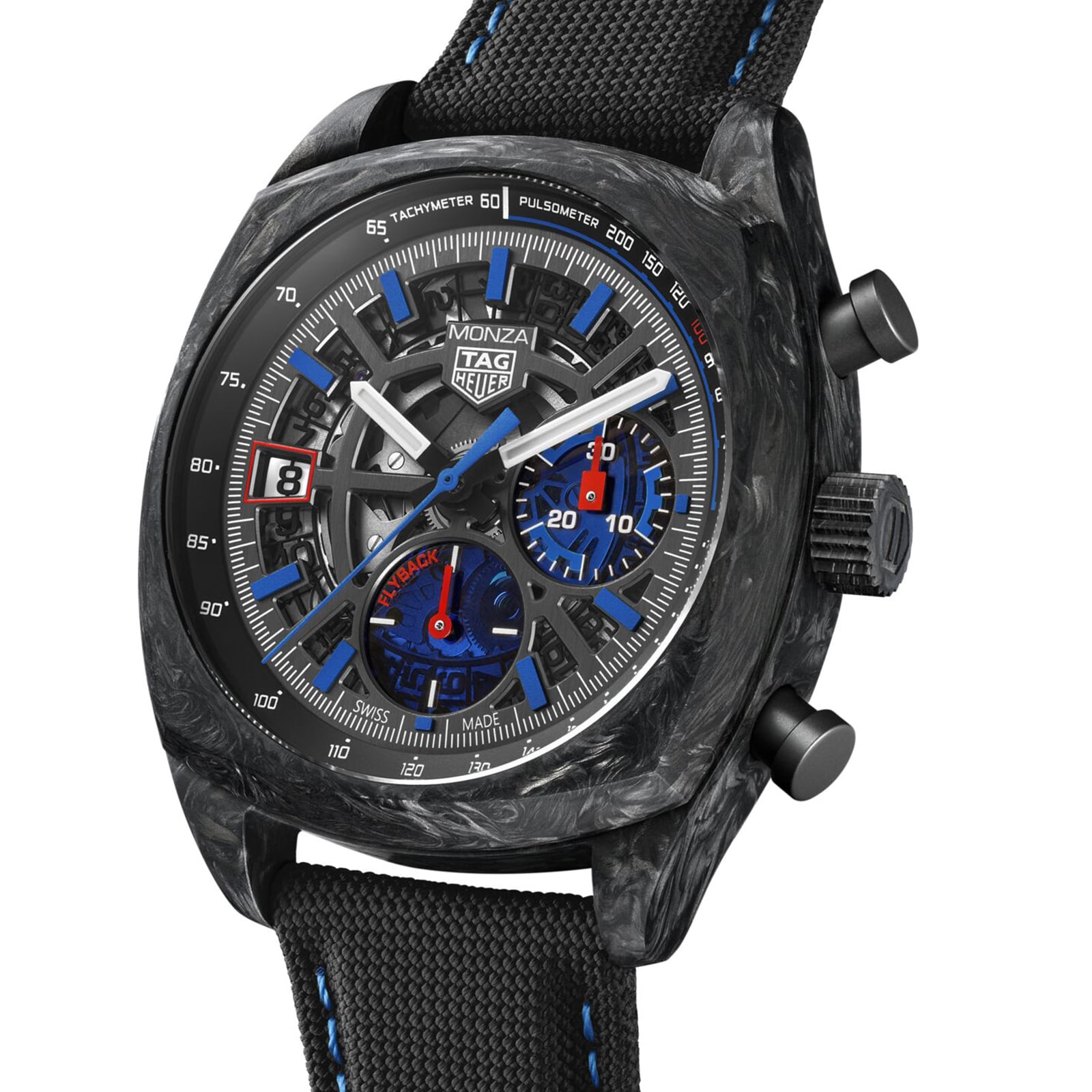 The TAG Heuer Monza Flyback Chronometer features a black carbon case, blue and red chronograph subdials, tachymeter and pulsometer scales, and a black fabric strap, all inspired by competition motorsports.