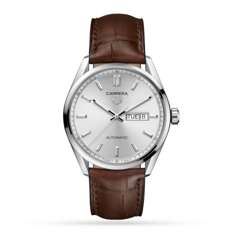 The TAG Heuer Carrera Day-Date is a silver automatic wristwatch with calibre 5 movement, silver dial, day-date at 3 o’clock, and a classic brown alligator leather strap.