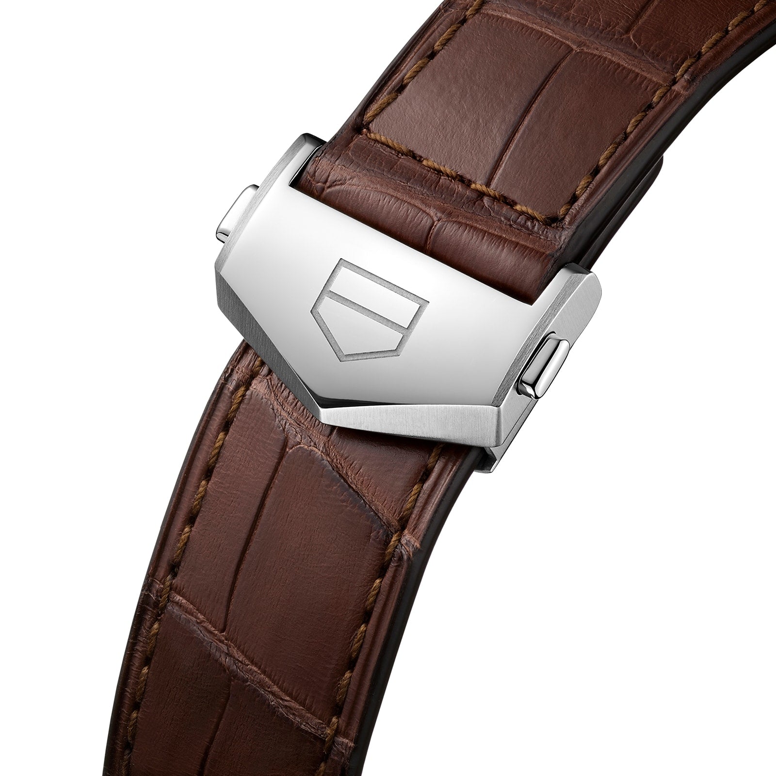The TAG Heuer Carrera Day-Date features a brown leather strap with visible stitching and a silver clasp engraved with the geometric TAG Heuer logo.