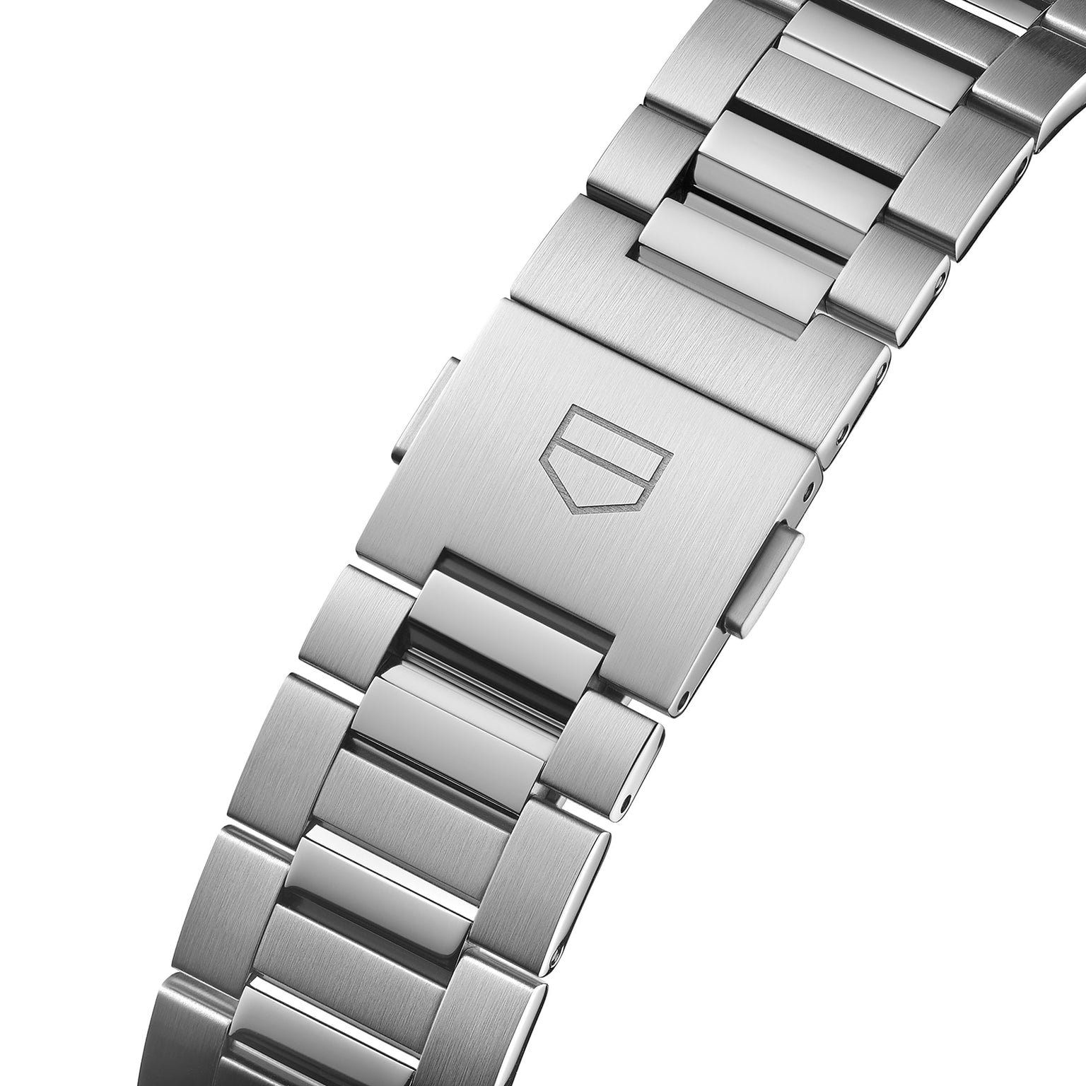 Close-up of a stainless steel TAG Heuer Carrera Day-Date bracelet with a secure clasp and engraved shield logo, paired with a blue sunray dial and calibre 5 automatic movement.